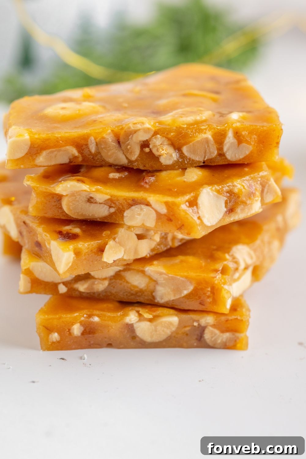 Classic Crunchy Peanut Brittle Made Simple 16 Homemade Peanut Brittle stacked on a white table