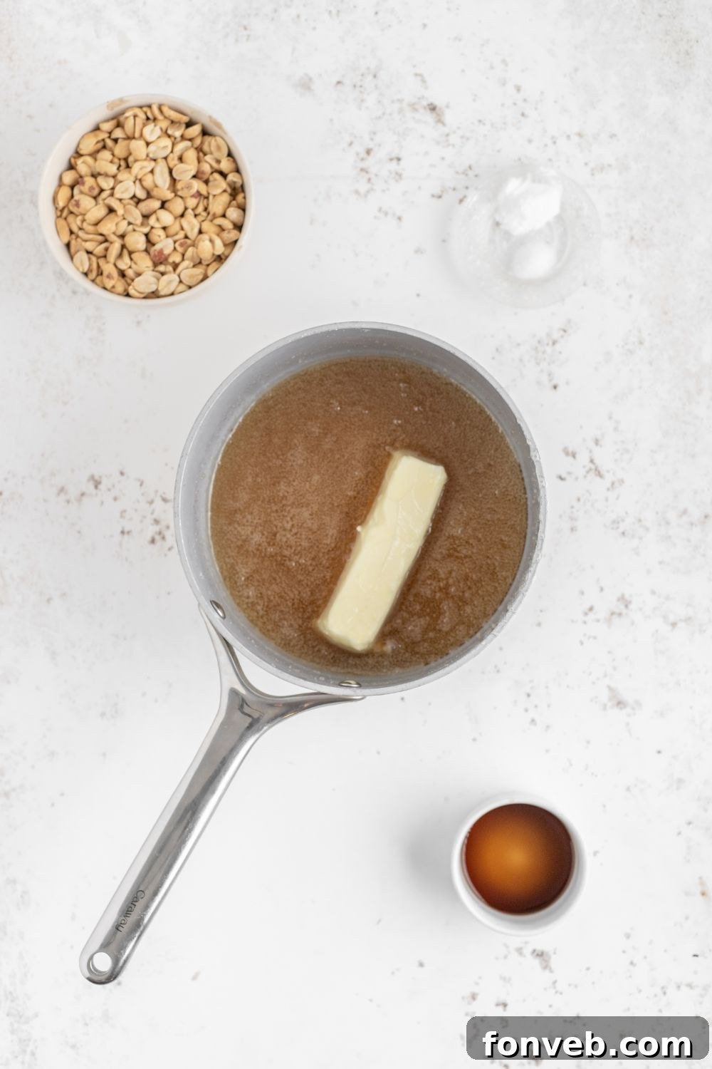 Classic Crunchy Peanut Brittle Made Simple 7 Homemade Peanut Brittle being made in saucepan with butter in it