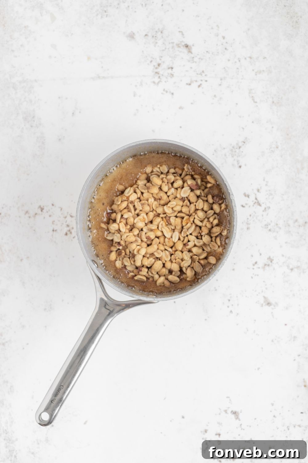 Classic Crunchy Peanut Brittle Made Simple 10 saucepan with Homemade Peanut Brittle being made