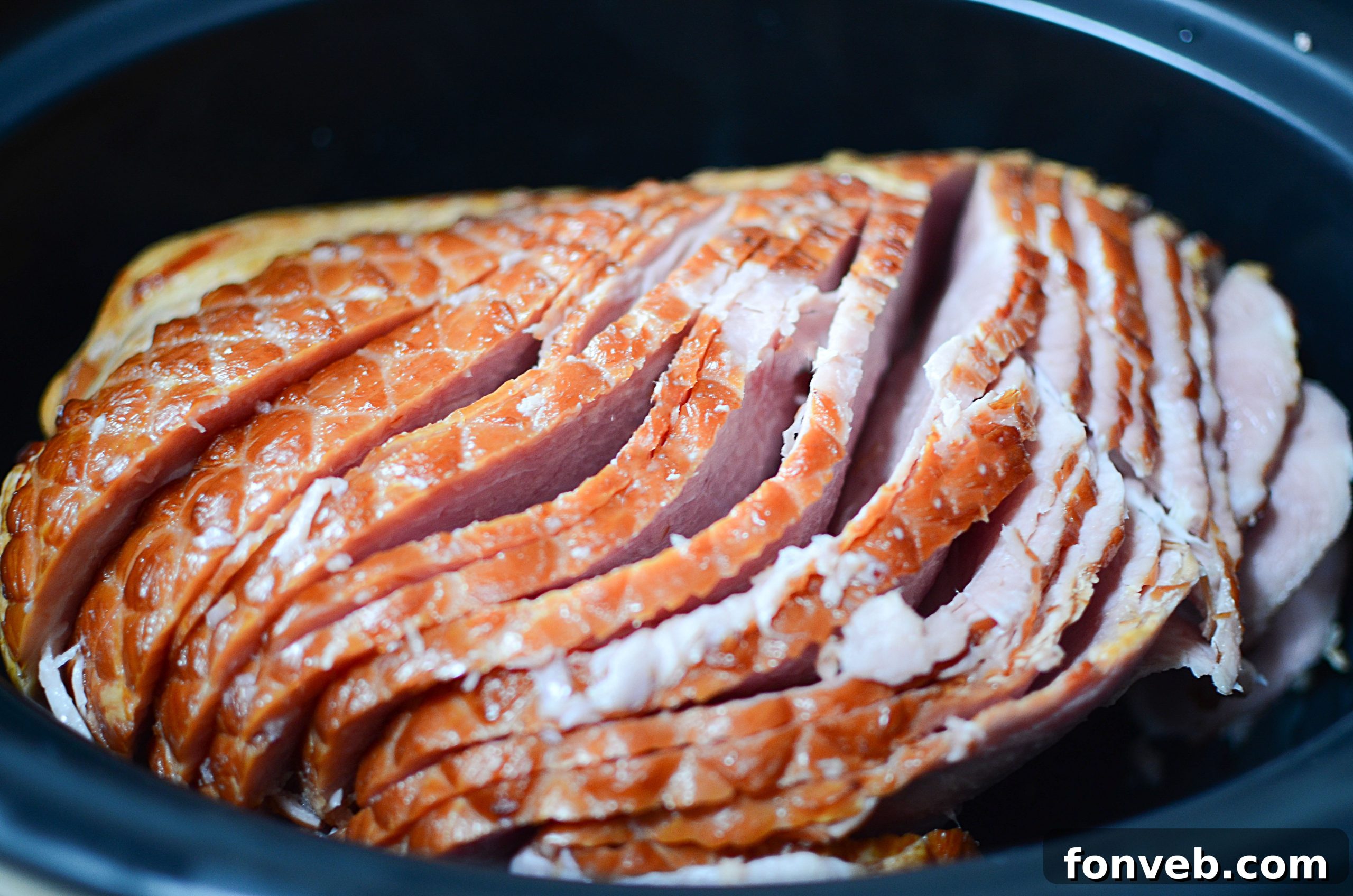 Slow Cooker Caramelized Pineapple Ham 3 Close-up of slow cooker pineapple upside down ham, showing rich glaze and fruit.