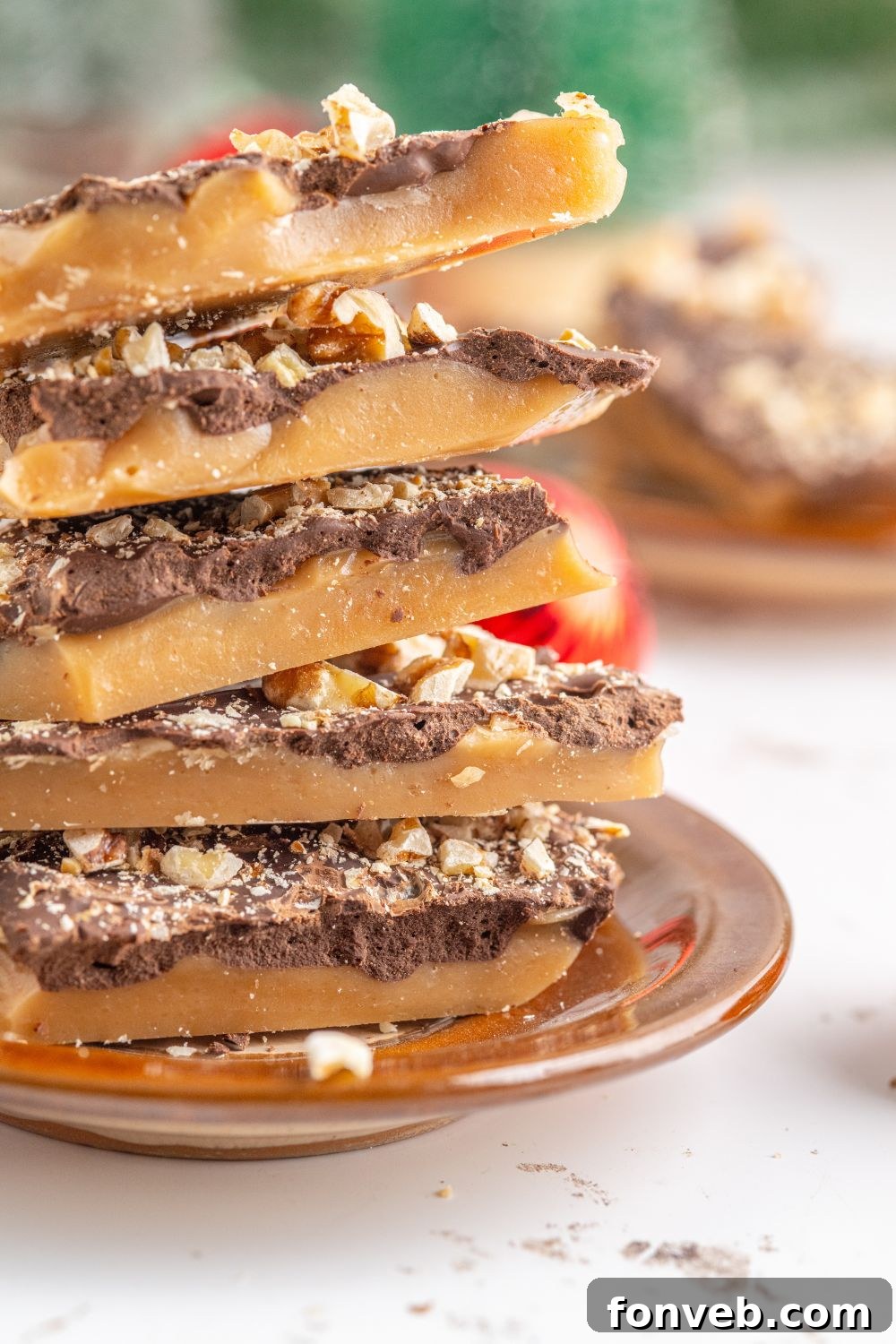 stack of English Toffee on a plate on a white table 