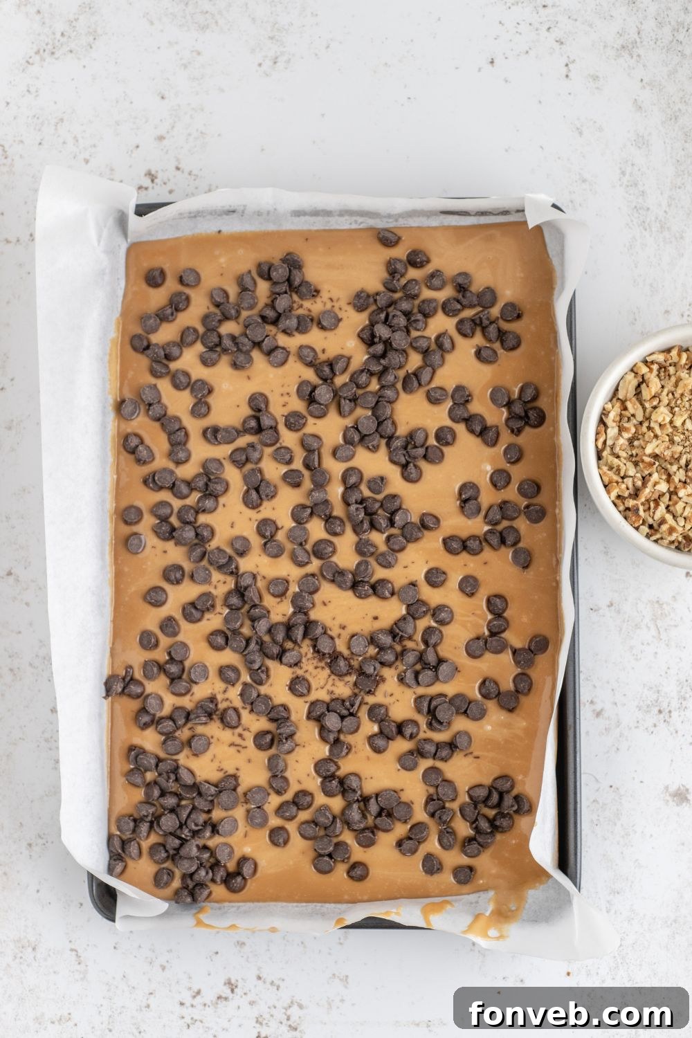 chocolate chips topped on softened toffee 