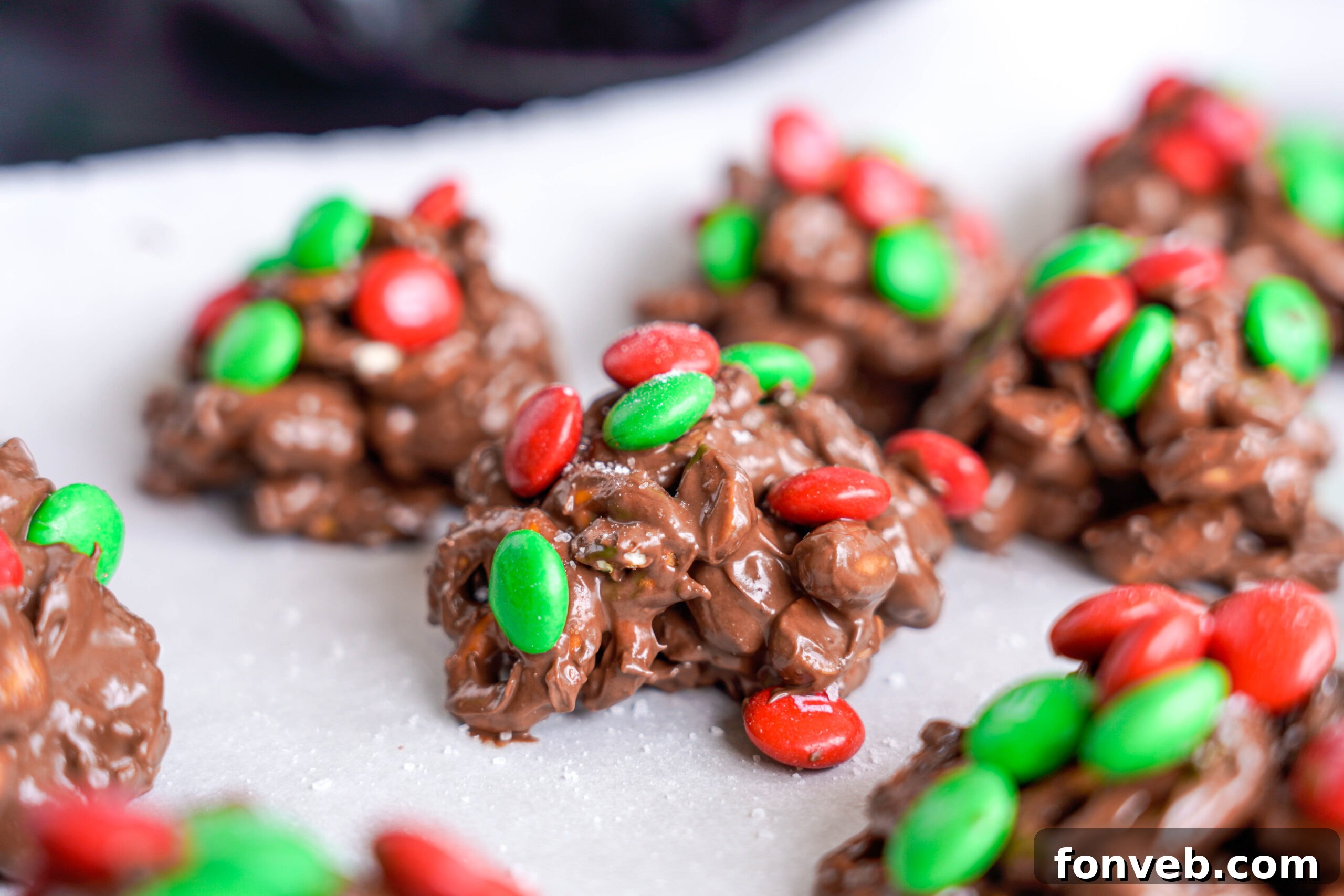 Sweet and Salty Slow Cooker Holiday Clusters 22 Crockpot Chocolate Pretzel Christmas Candy on a baking sheet