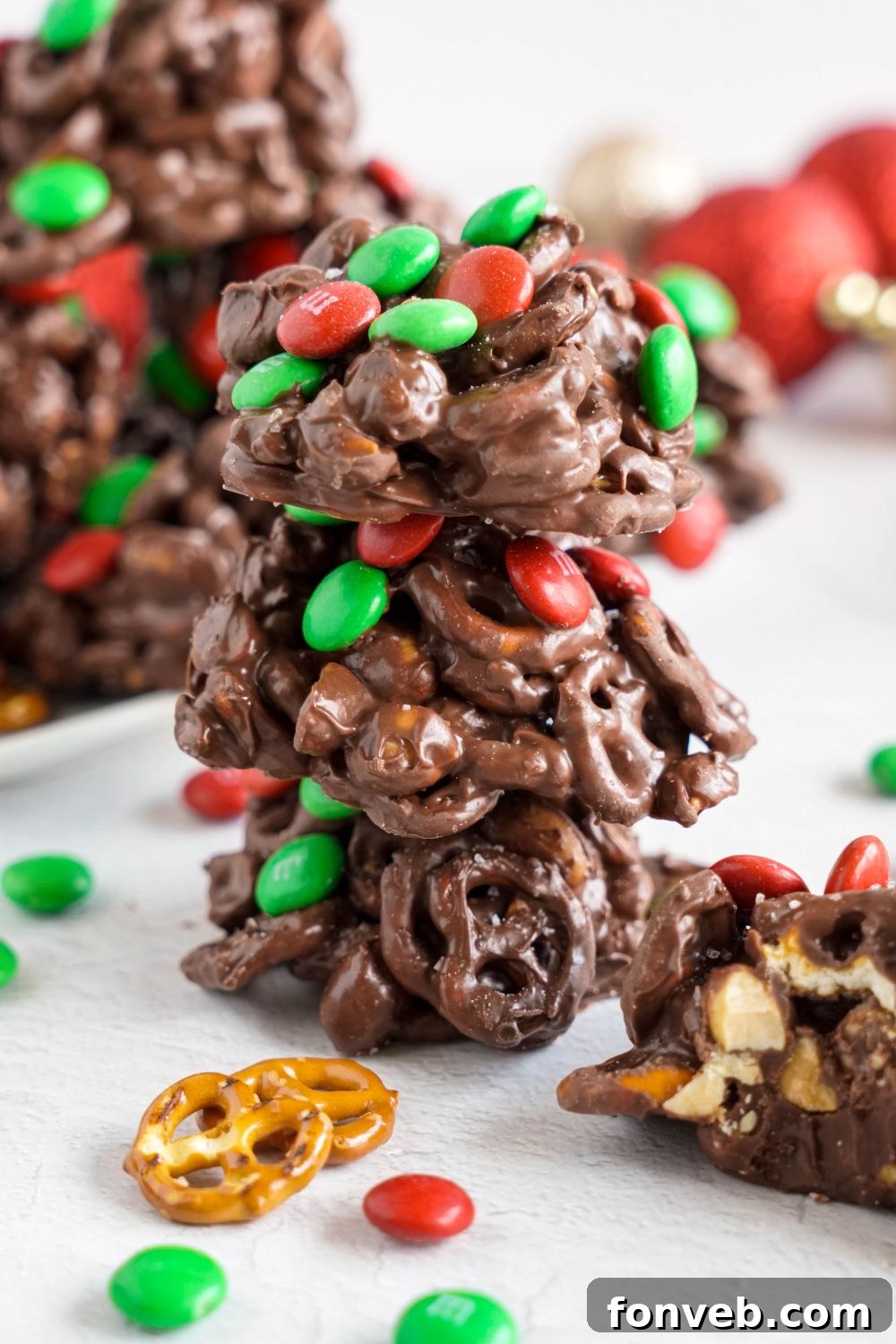 Sweet and Salty Slow Cooker Holiday Clusters 4 stack of Crockpot Chocolate Pretzel Christmas Candy and more around the table