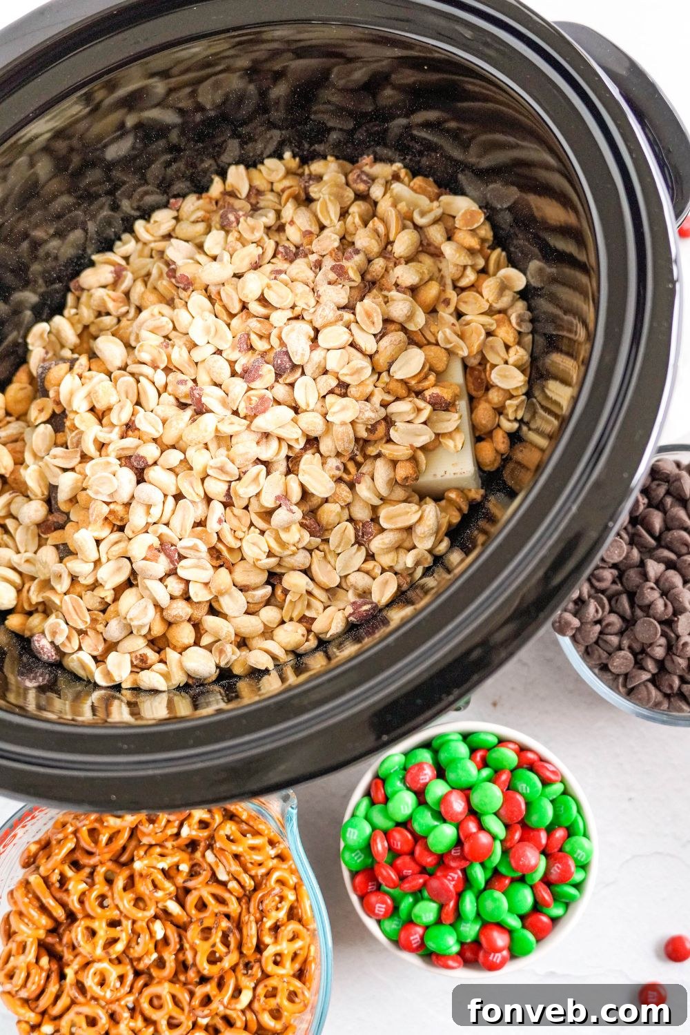 Sweet and Salty Slow Cooker Holiday Clusters 8 peanuts and chocolate in a slow cooker
