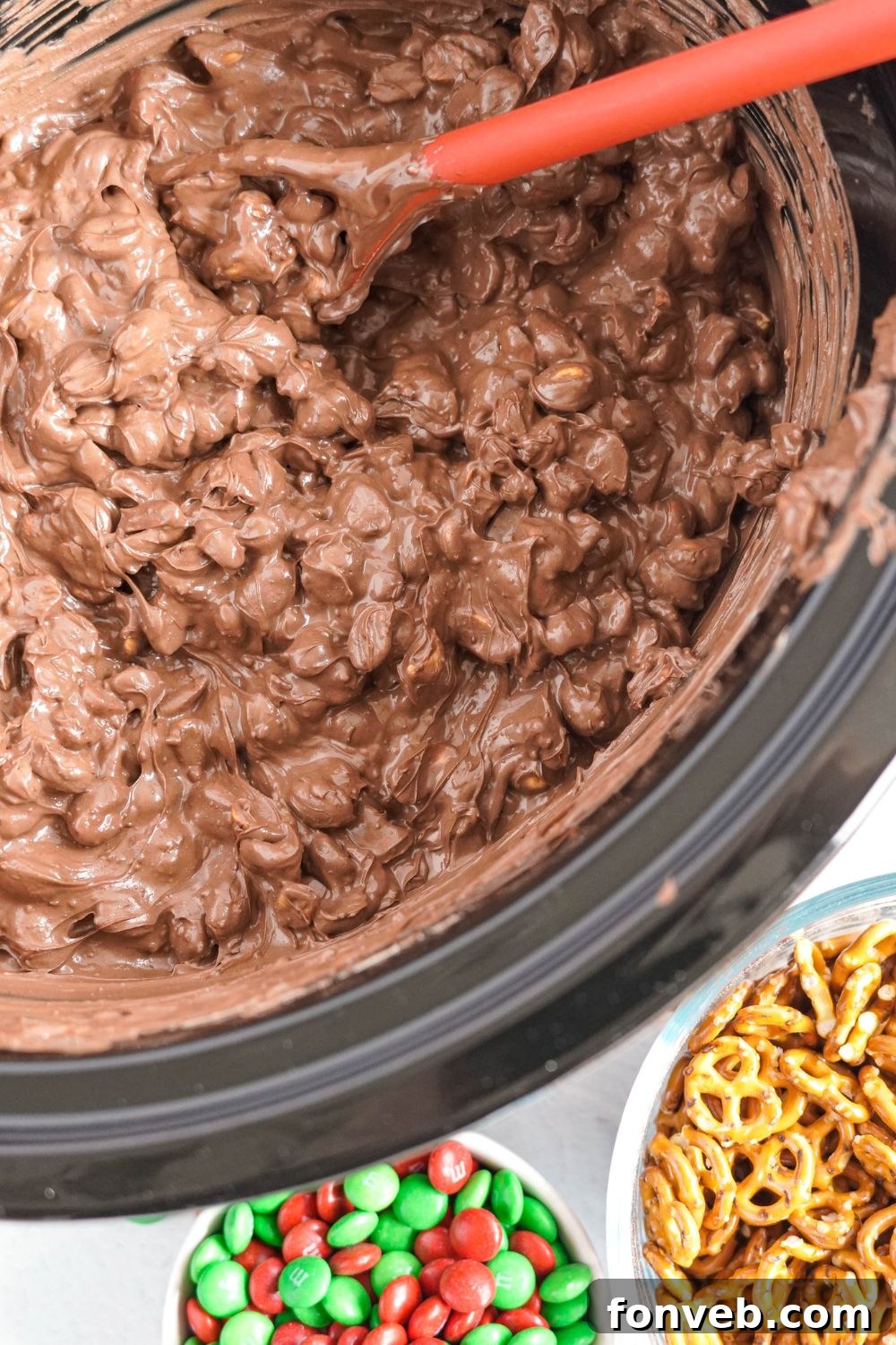 Sweet and Salty Slow Cooker Holiday Clusters 10 mixture of chocolate and nuts and pretzels