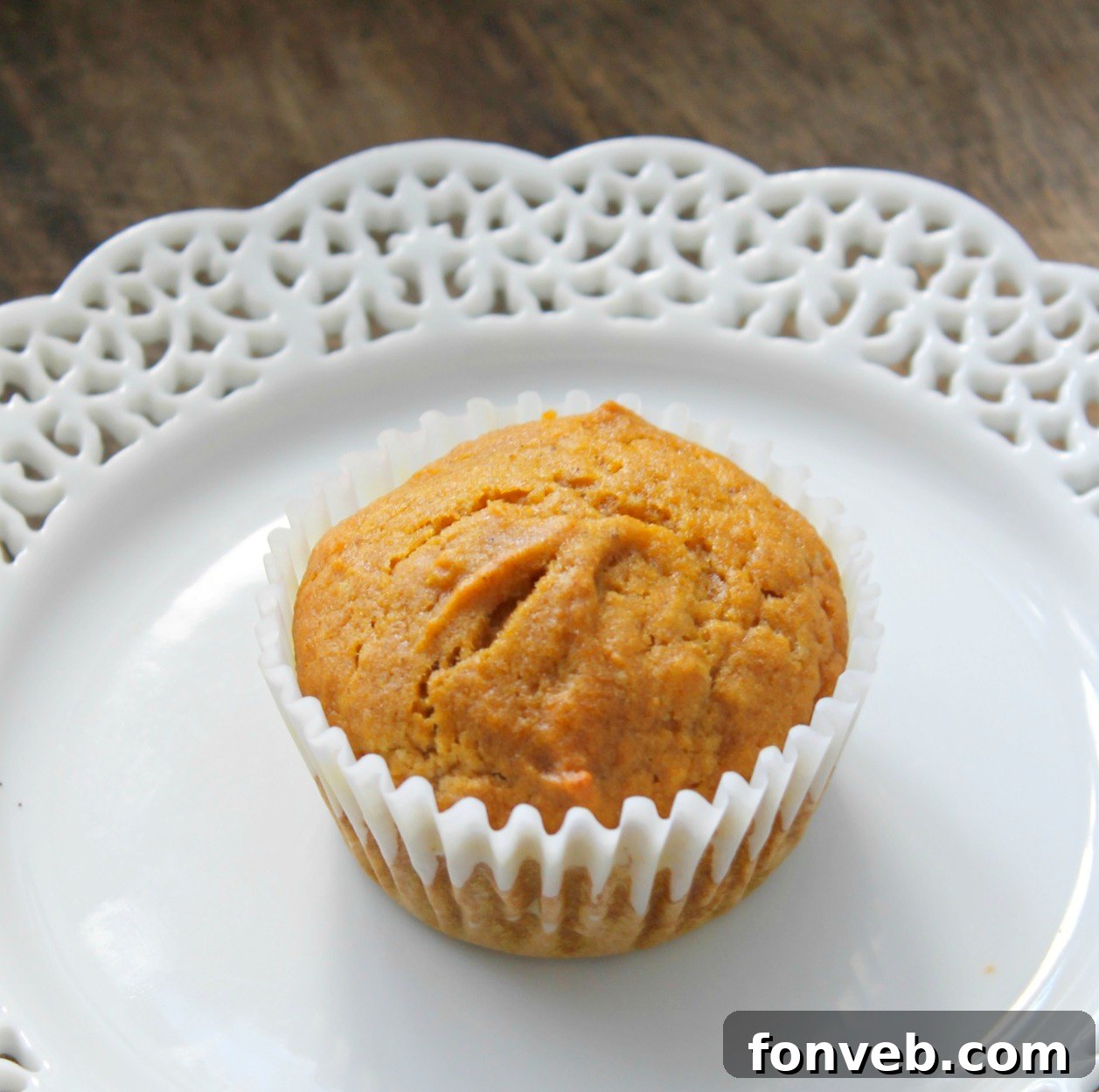 Warm Spiced Butternut Muffins 2 Freshly baked butternut squash muffins cooling on a wire rack, ready to be enjoyed.