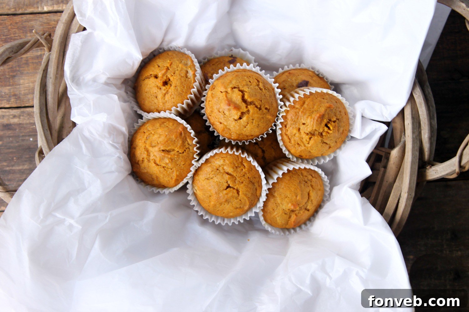 Warm Spiced Butternut Muffins 4 A freshly baked butternut squash muffin with a pat of butter melting on top, ready for breakfast.