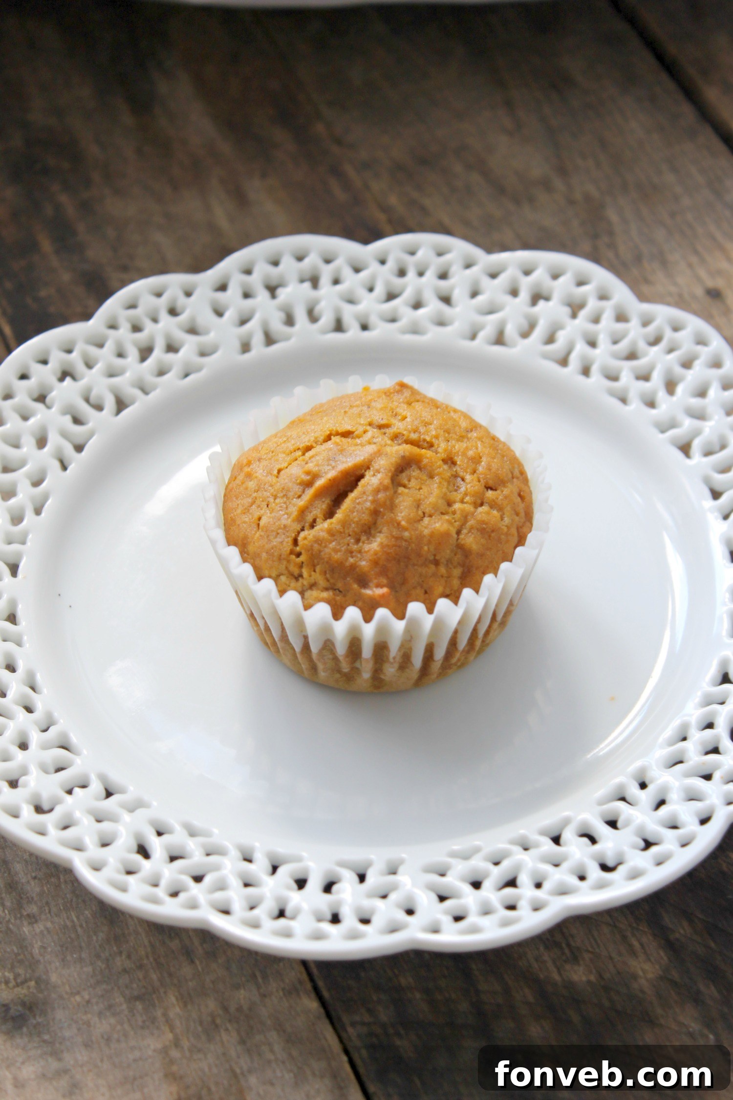 Warm Spiced Butternut Muffins 7 A child's hand reaching for a butternut squash muffin, illustrating their broad appeal.