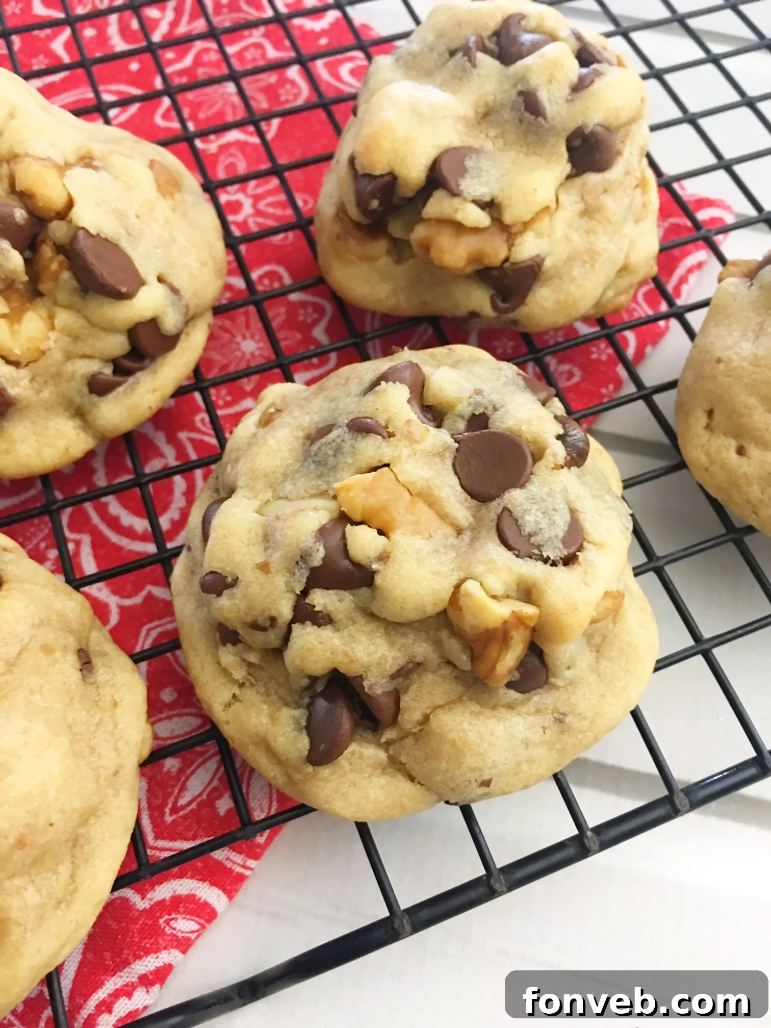 Freshly baked soft chocolate chip cookies on a cooling rack