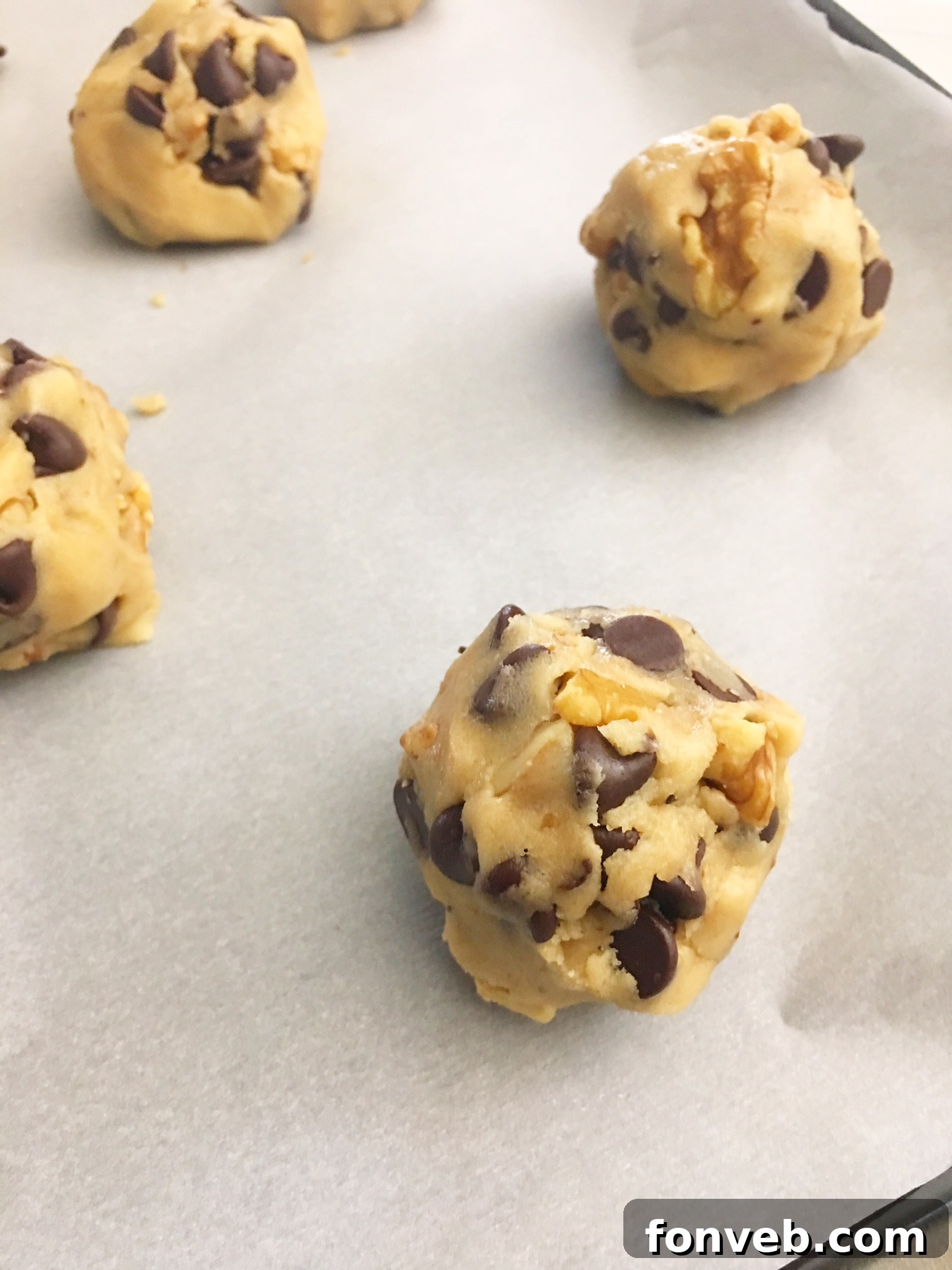 Close-up of a single perfectly baked chocolate chip cookie