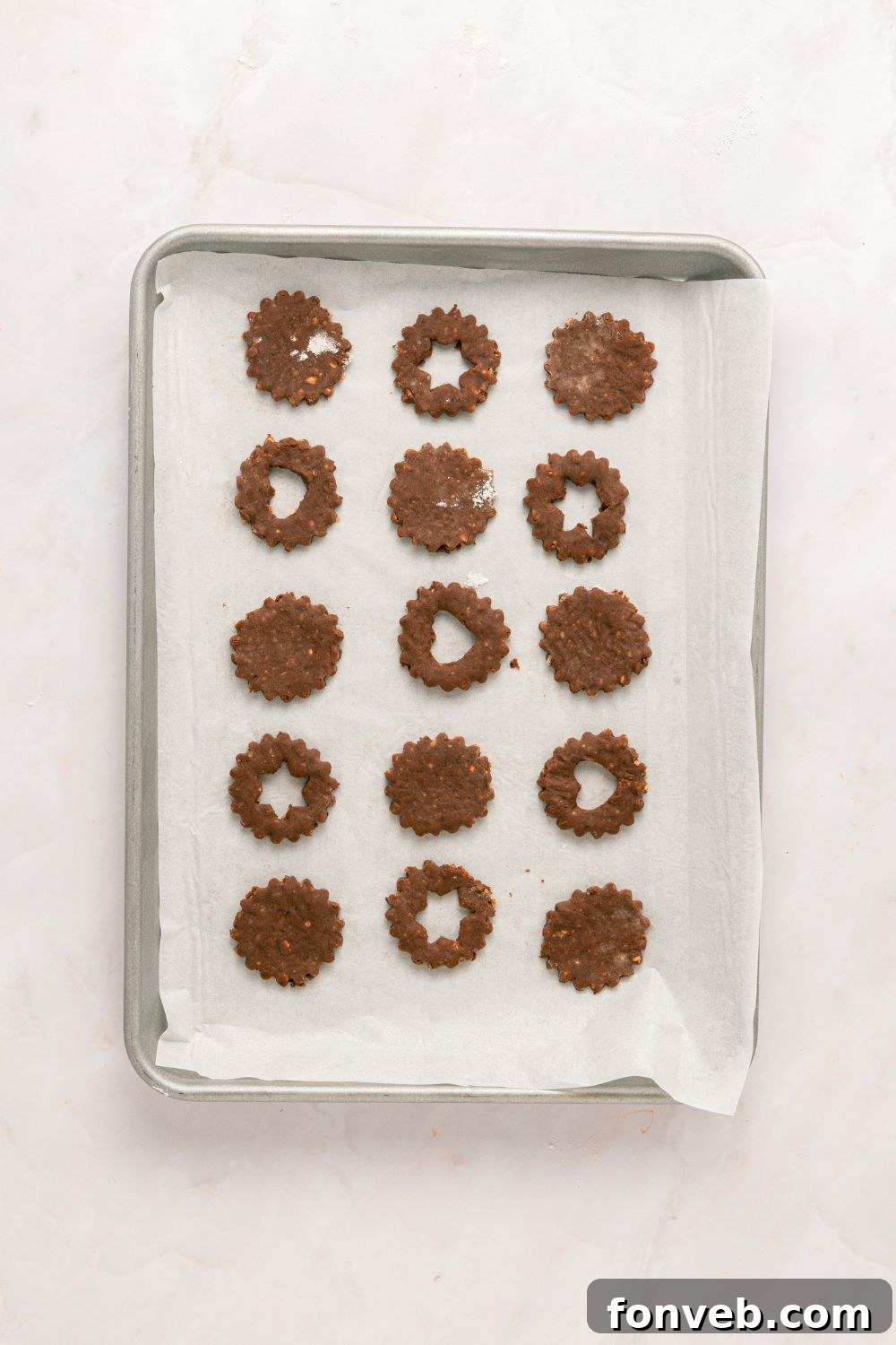 baking sheet with cooked Chocolate Linzer Cookies cooling 