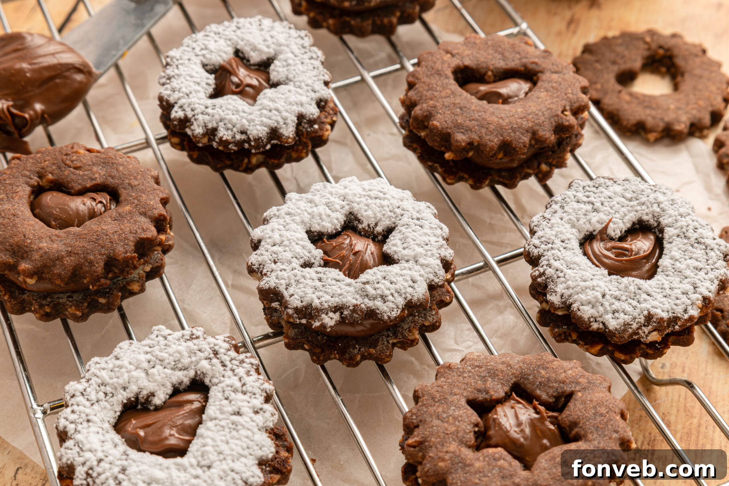 cooling rack full of Chocolate Linzer Cookies