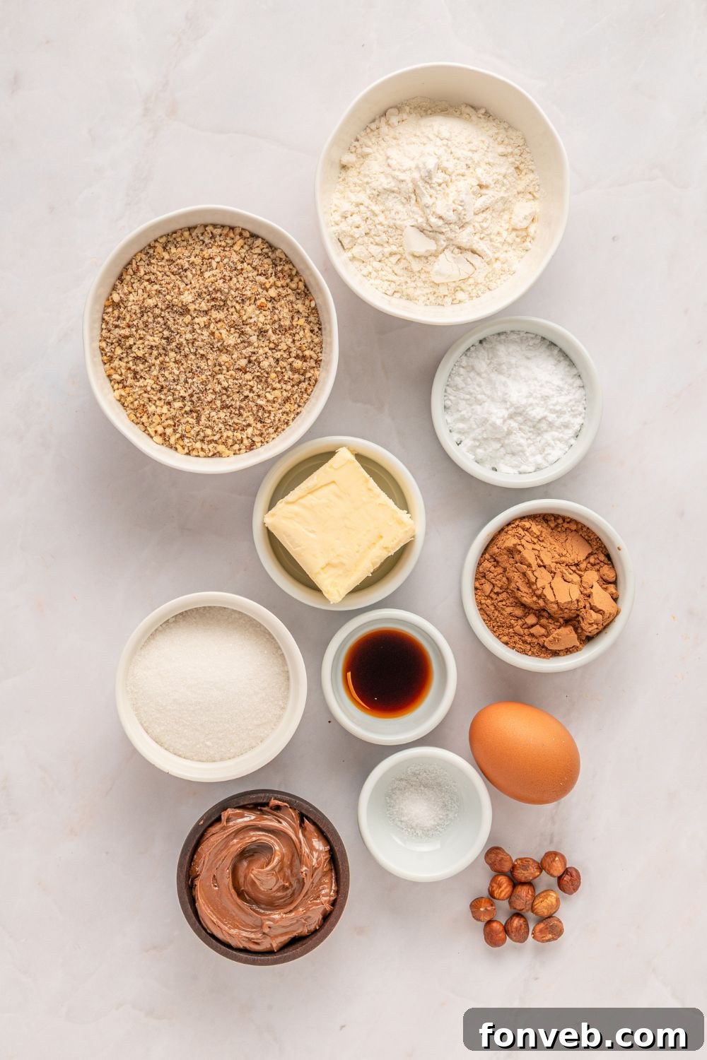 bowls of ingredients for Chocolate Linzer Cookies on the table 