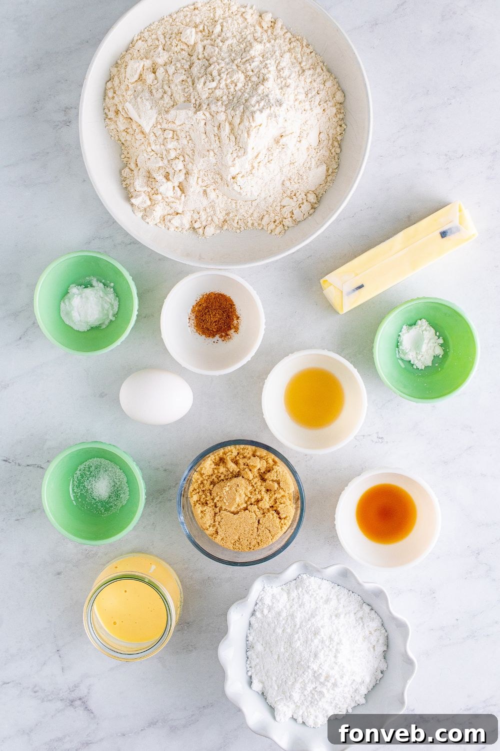 ingredients for Soft Frosted Eggnog Cookies in single serve containers on table