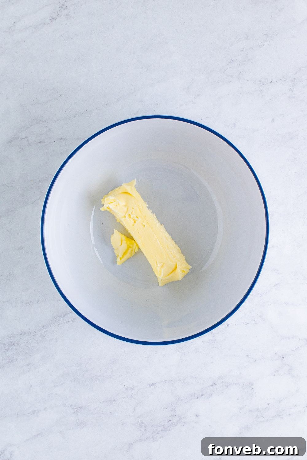 stock of butter in a white bowl on table