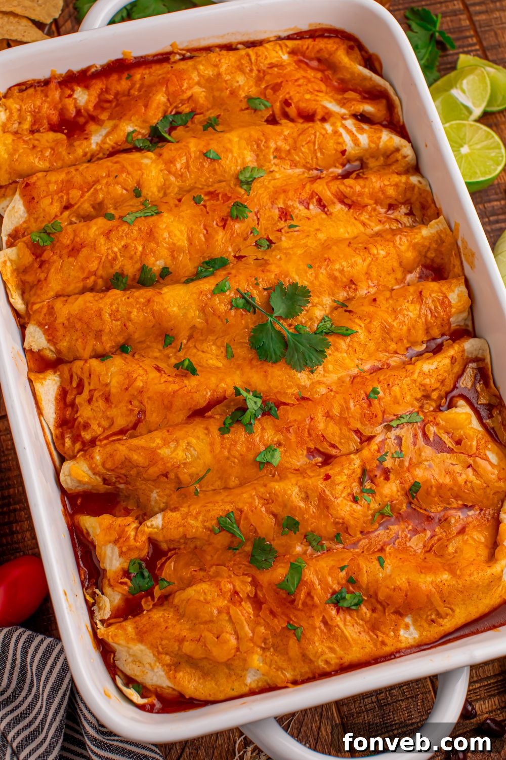 Steak Enchiladas in a casserole dish with cilantro sprinkle on top 