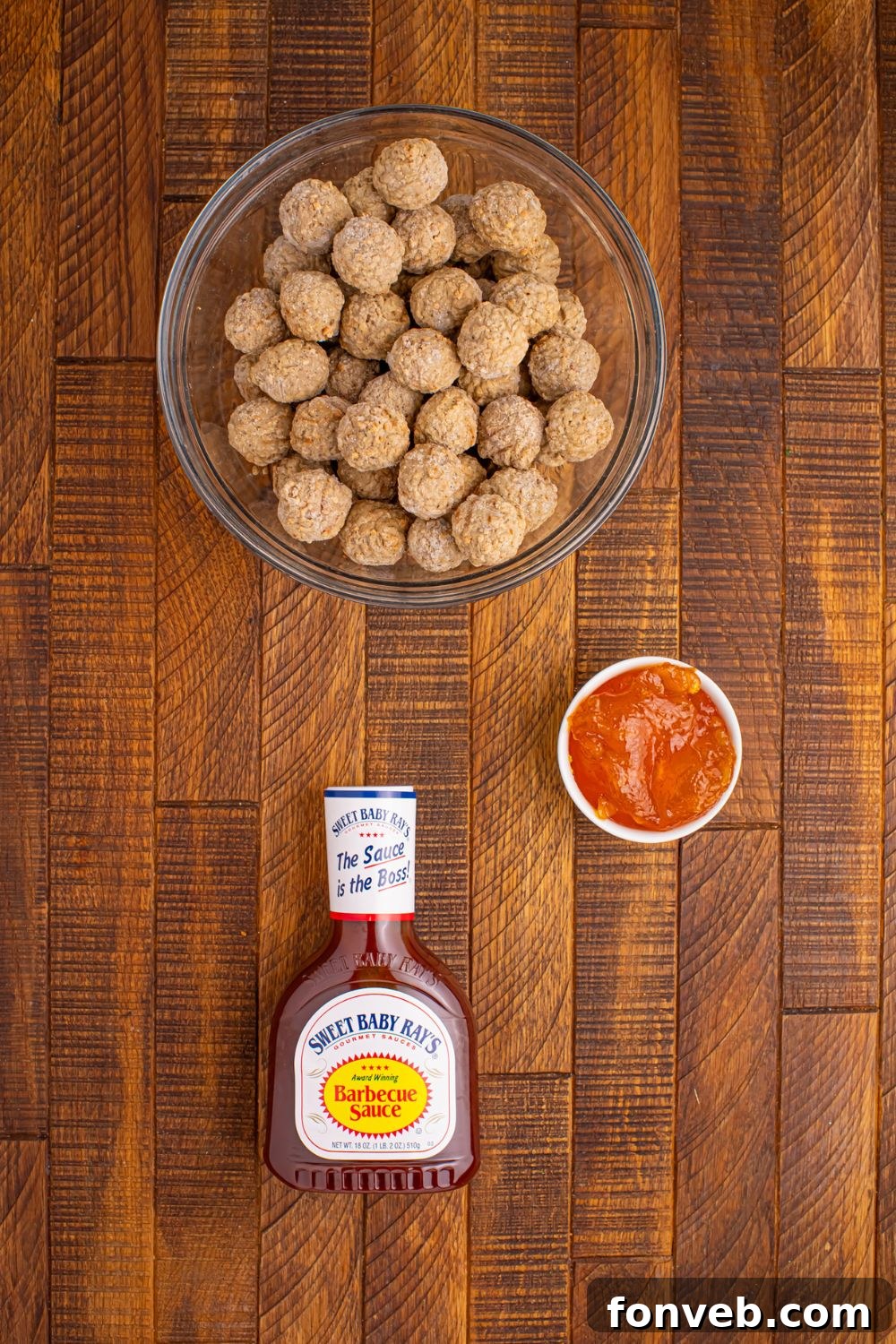 Peach BBQ Meatballs ingredients on table in single serve bowls, and a bottle of bbq sauce 