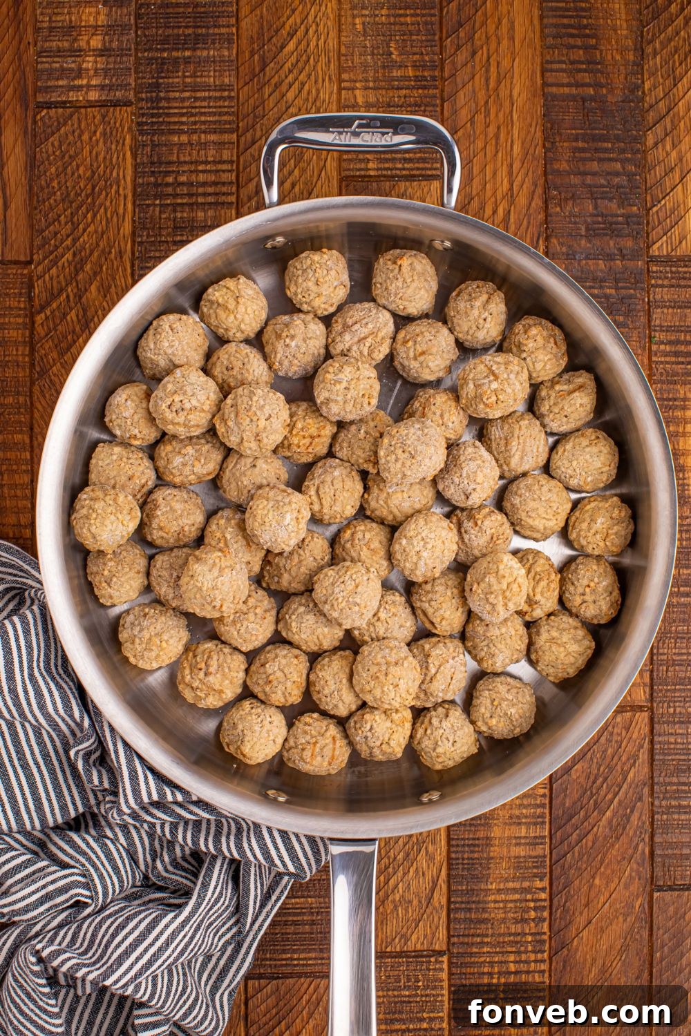 frozen meatballs in a skillet on the table 