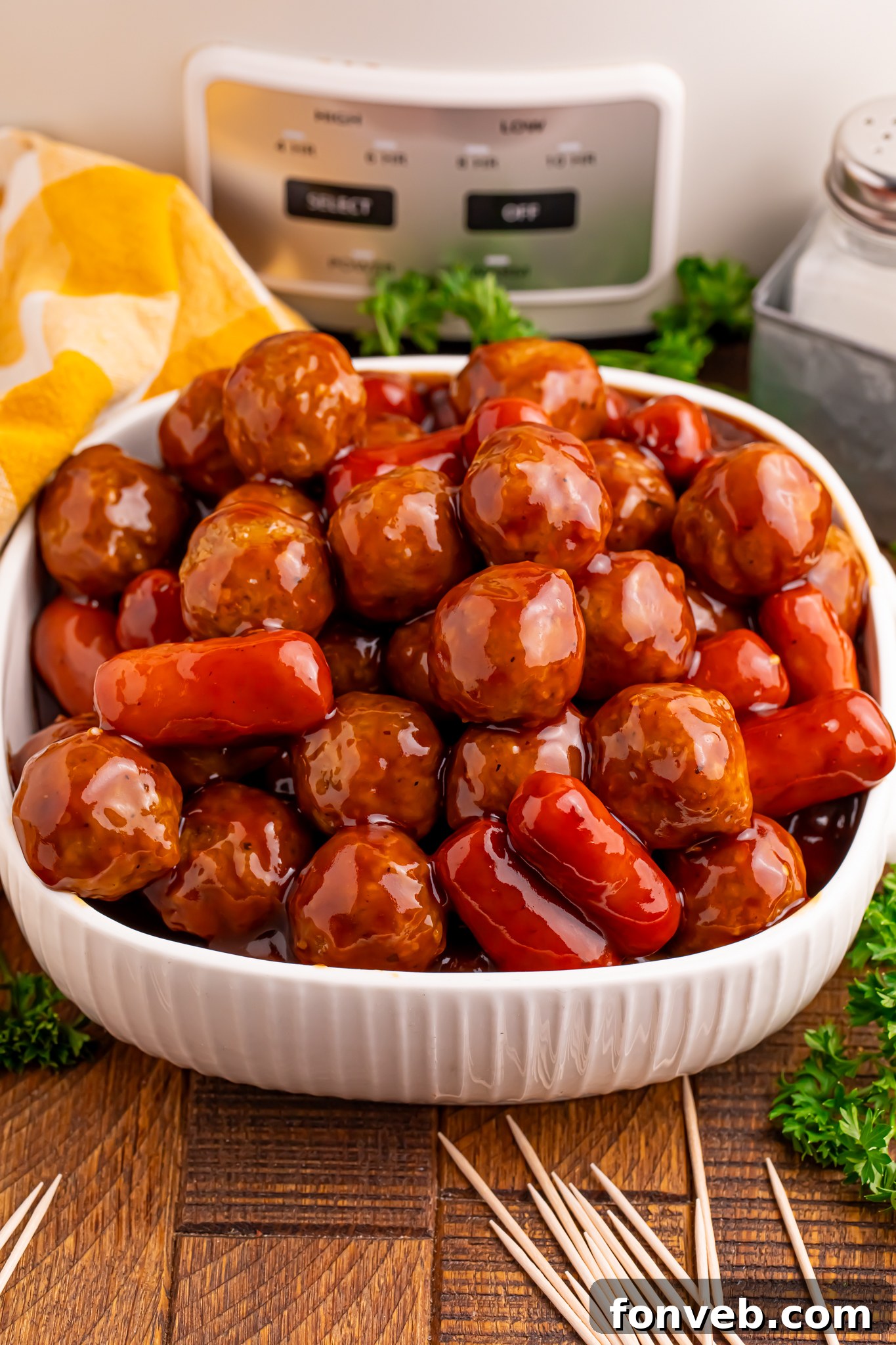 Crockpot Teriyaki BBQ Cocktail Meatballs & Lil Smokies in a large white serving bowl 