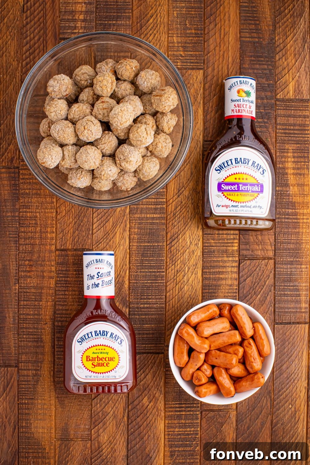 frozen meatballs, two bottles of sauce and little smokies all in bowls on table for making the party appetizer 