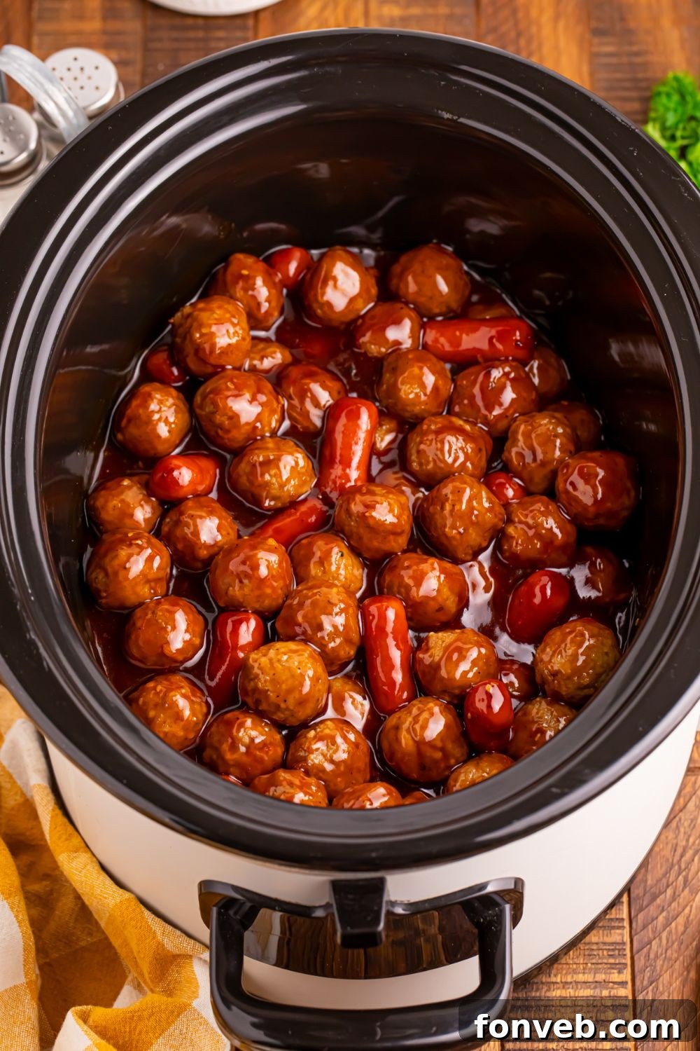 Crockpot Teriyaki BBQ Cocktail Meatballs & Lil Smokies in a crockpot all cooked and ready to be served 