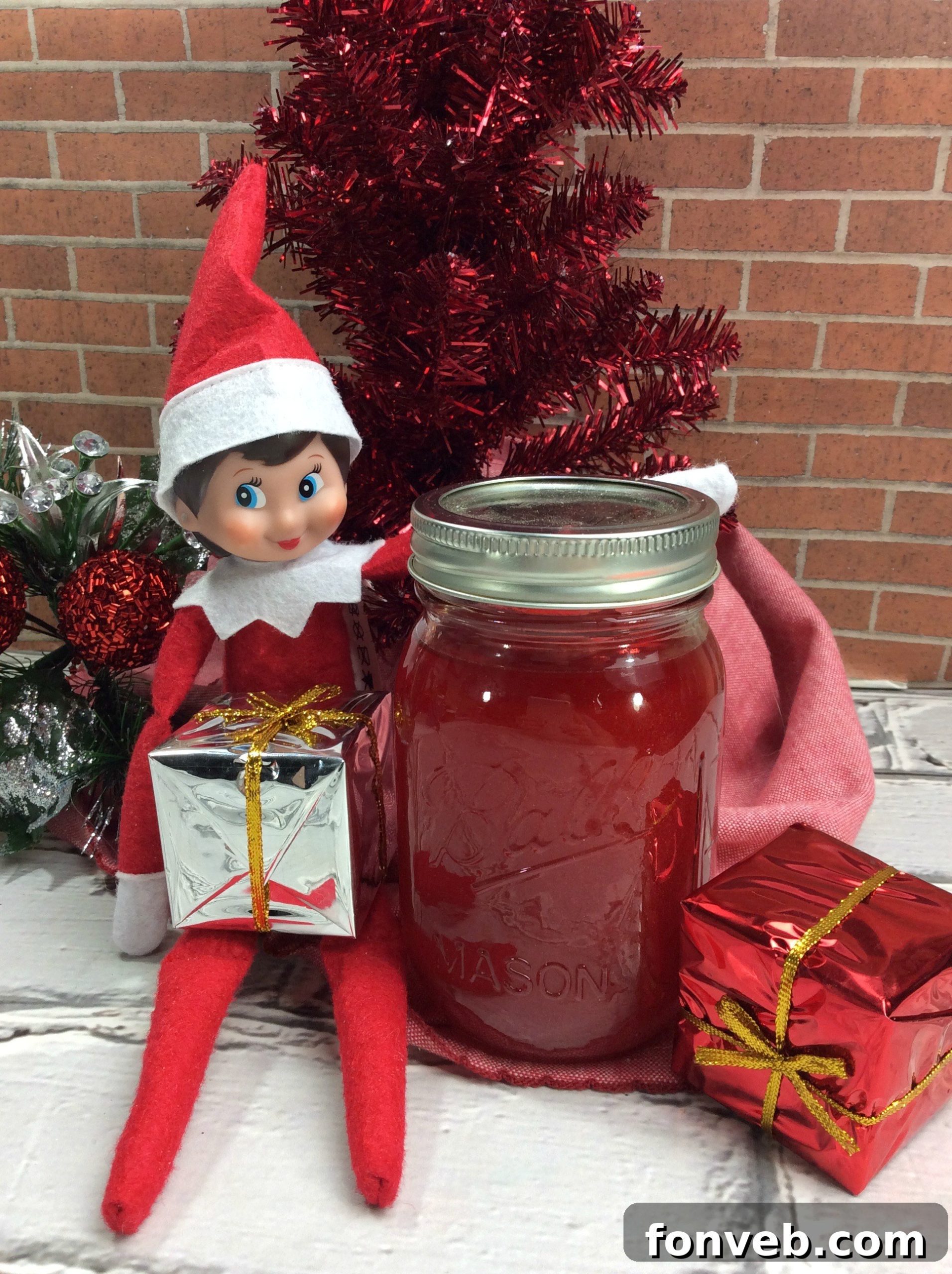 Enchanted Forest Brew 4 Three mason jars filled with Elf Jungle Juice, showing off the vibrant drink and fresh fruit garnishes like kiwi, lime, and strawberries.