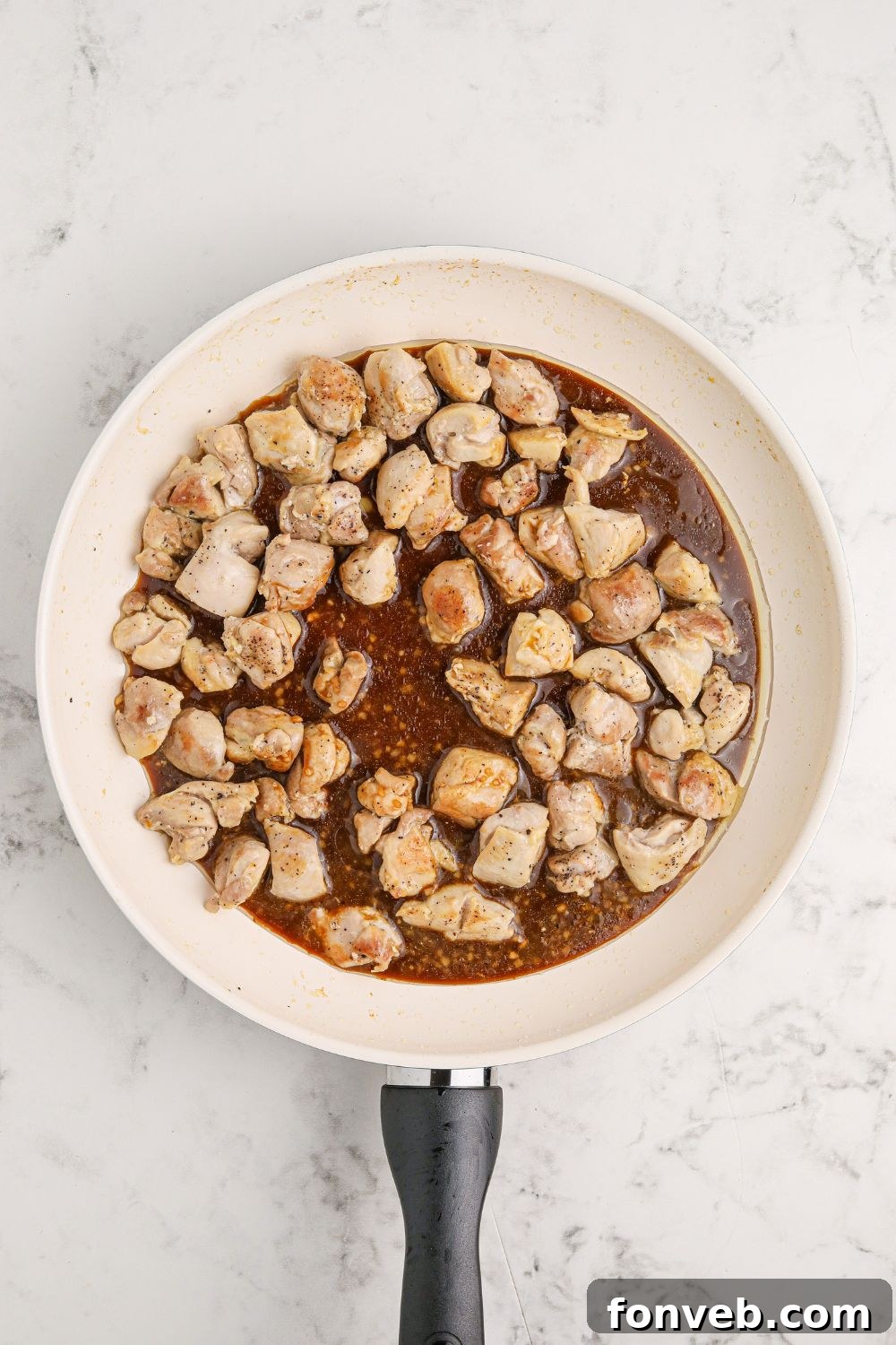 Irresistible Bourbon Chicken Skillet Quick Weeknight Win 9 diced chicken cooked and poured with sauce in a skillet on table