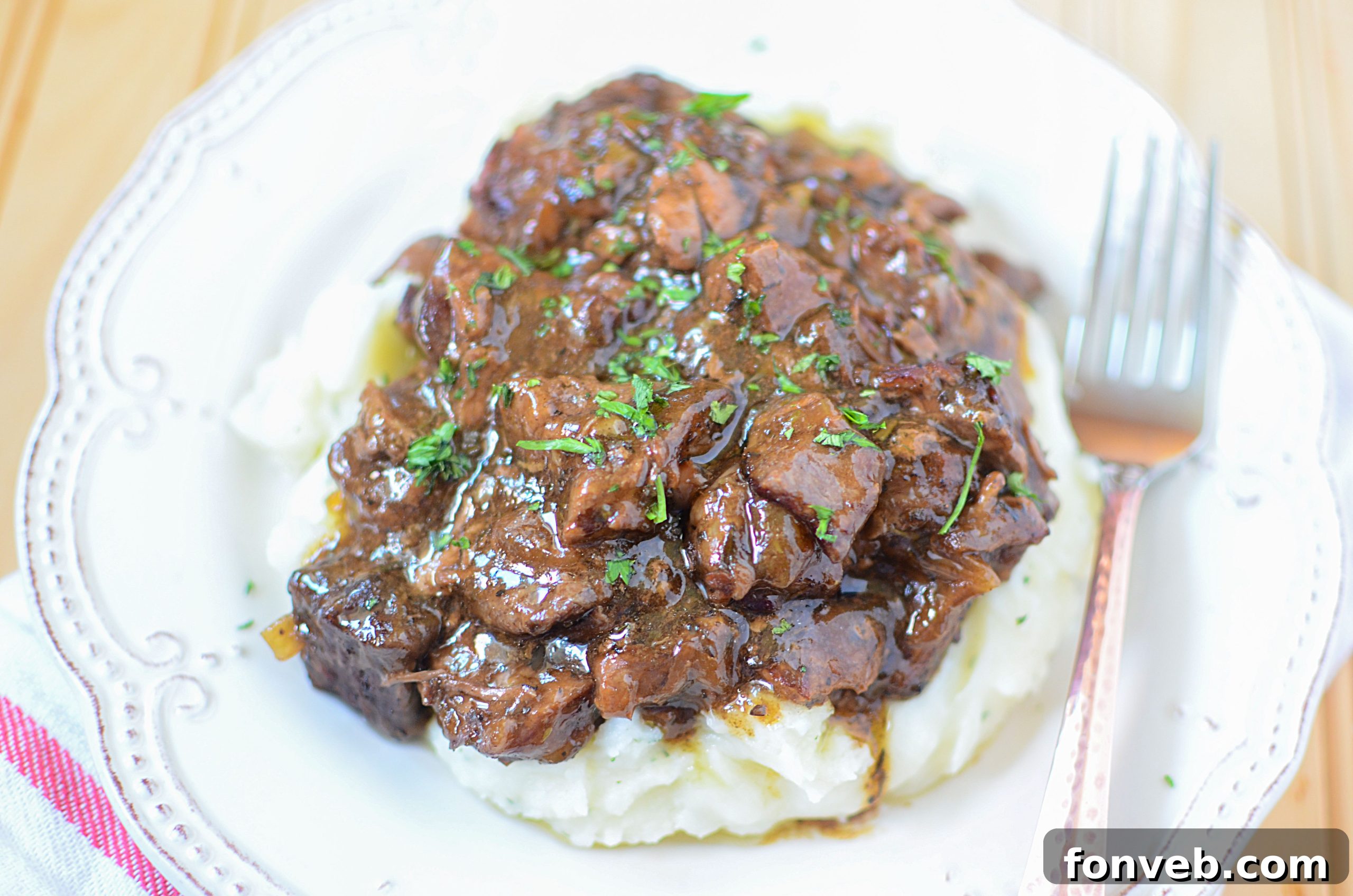 Melt-in-Your-Mouth Slow Cooker Sirloin Beef Tips Smothered in Rich Mushroom Gravy 6 Close-up of the Slow Cooker Sirloin Beef Tips in Mushroom Gravy, showcasing the tender meat and thick sauce.