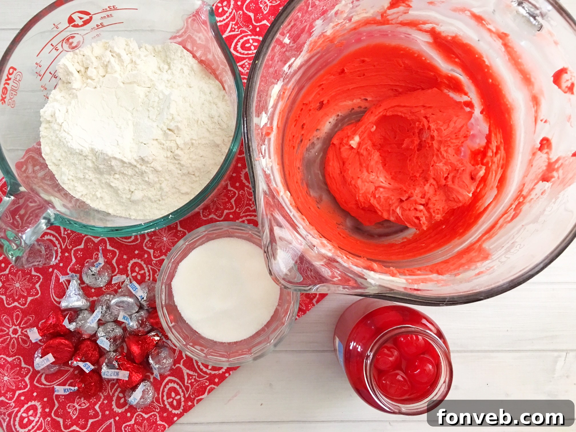 Freshly baked Cherry Kiss Cookies on a cooling rack, showcasing their soft texture and the melted chocolate kiss.