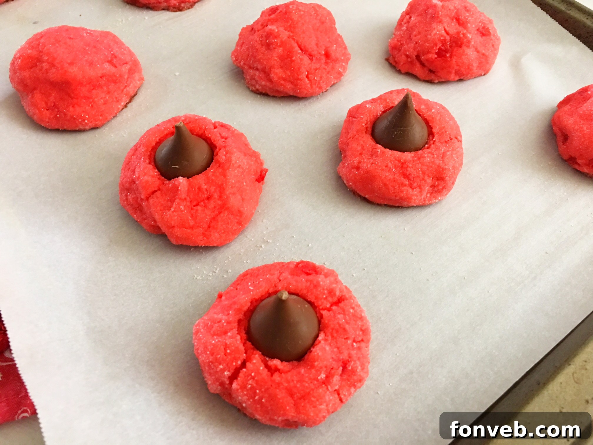 A platter of Cherry Kiss Cookies, showcasing the slight variations in their handmade form and inviting texture.