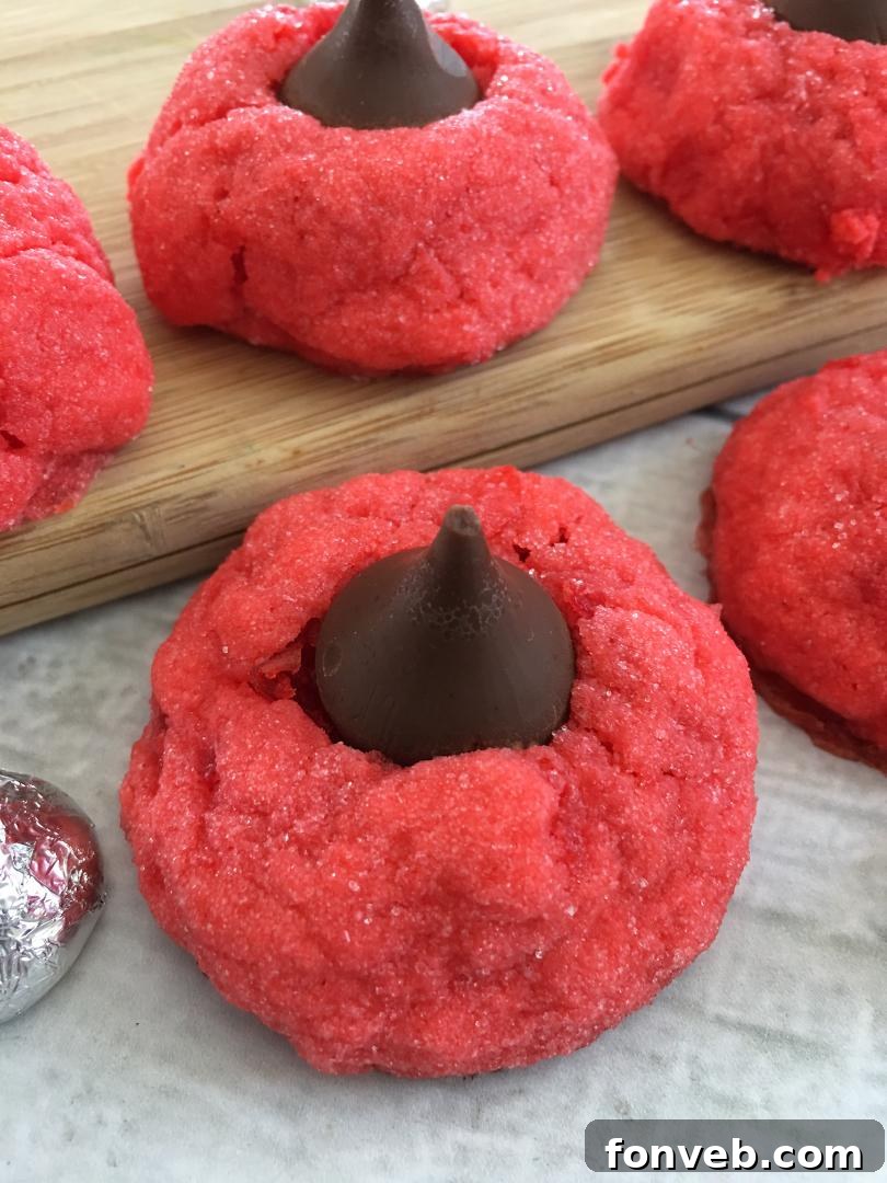 A stack of Cherry Kiss Cookies with a clear focus on their soft, chewy texture and the appealing chocolate topping.