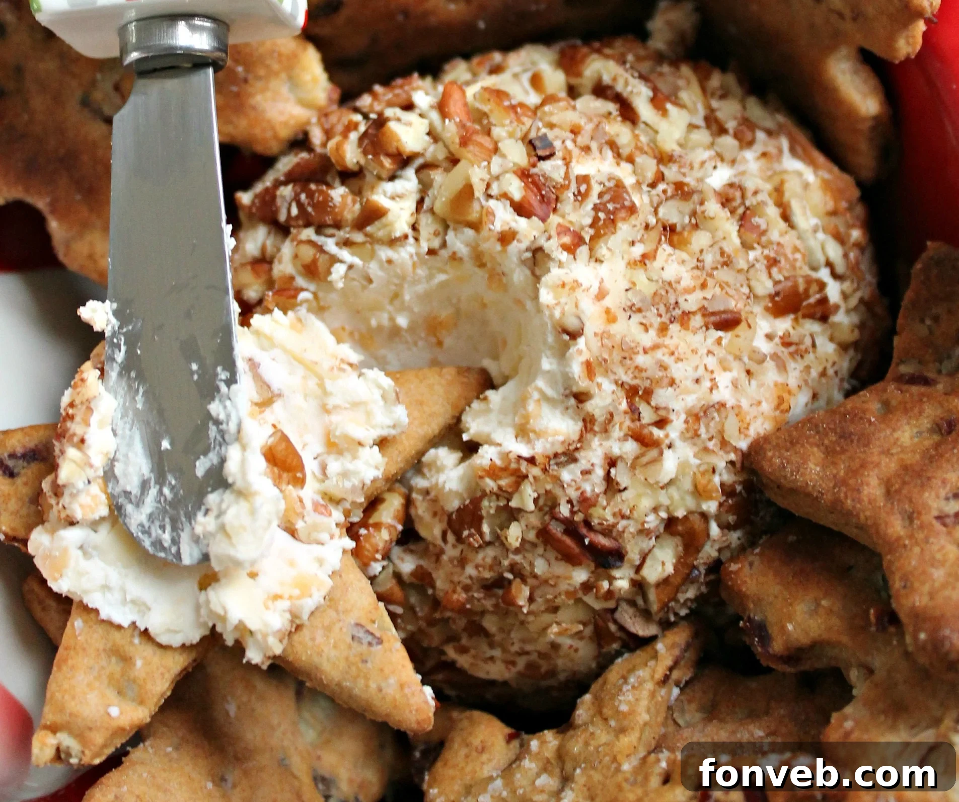 Delicious Bacon Cheddar Ranch Pecan Ball served on a platter with crackers, ready for a party.