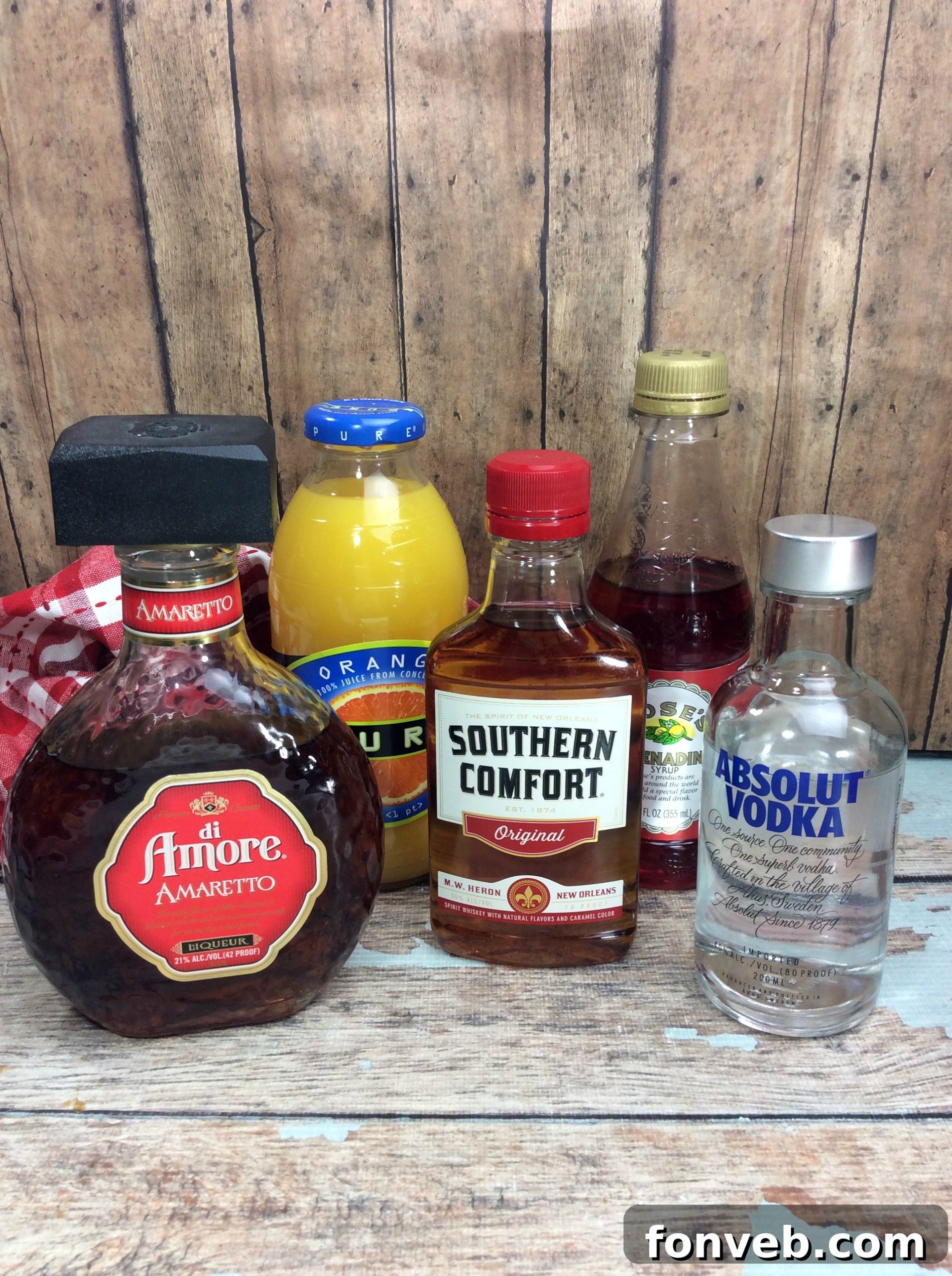 Twilight Tryst 3 A close-up shot of a single 'Take Me to the Bedroom' Cocktail, showcasing its alluring orange-red hue, garnished with a cherry and brimming with ice.