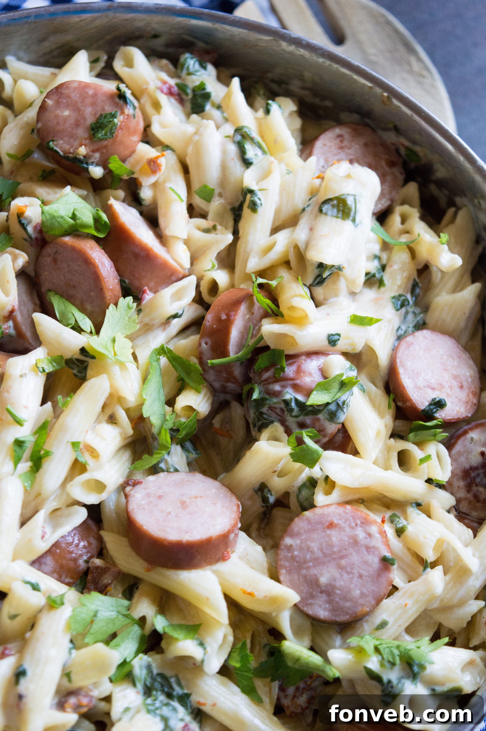 Luscious Garlic Mozzarella Pasta with Spinach and Sausage 5 Close-up of the creamy pasta dish showing the perfectly cooked sausage and spinach