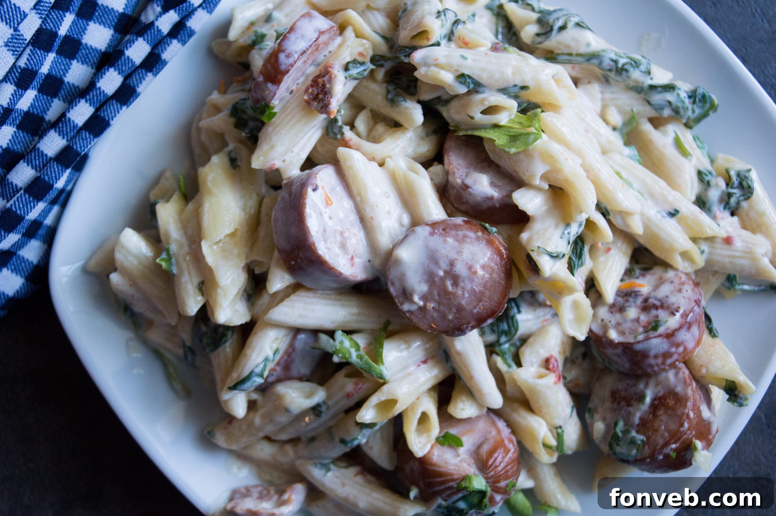 Luscious Garlic Mozzarella Pasta with Spinach and Sausage 6 Another mouth-watering angle of the Creamy Mozzarella Pasta, highlighting its rich texture