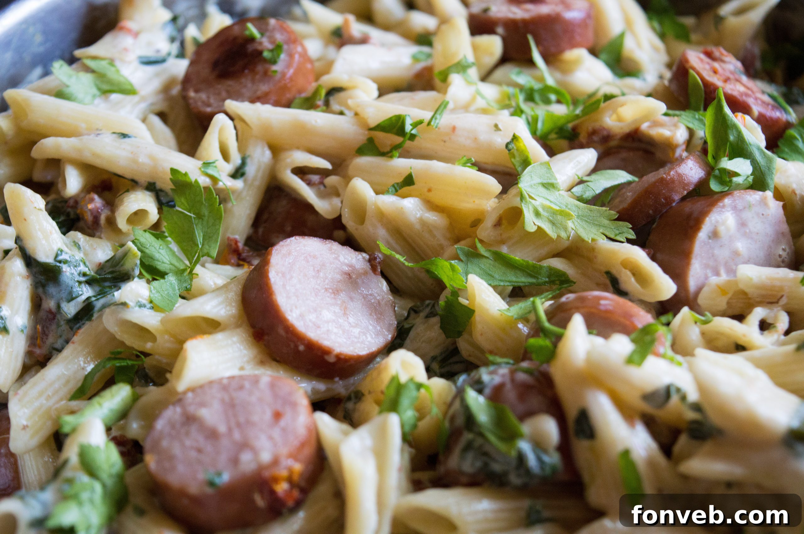 Luscious Garlic Mozzarella Pasta with Spinach and Sausage 8 A generous serving of Creamy Mozzarella Pasta, showcasing its beautiful presentation