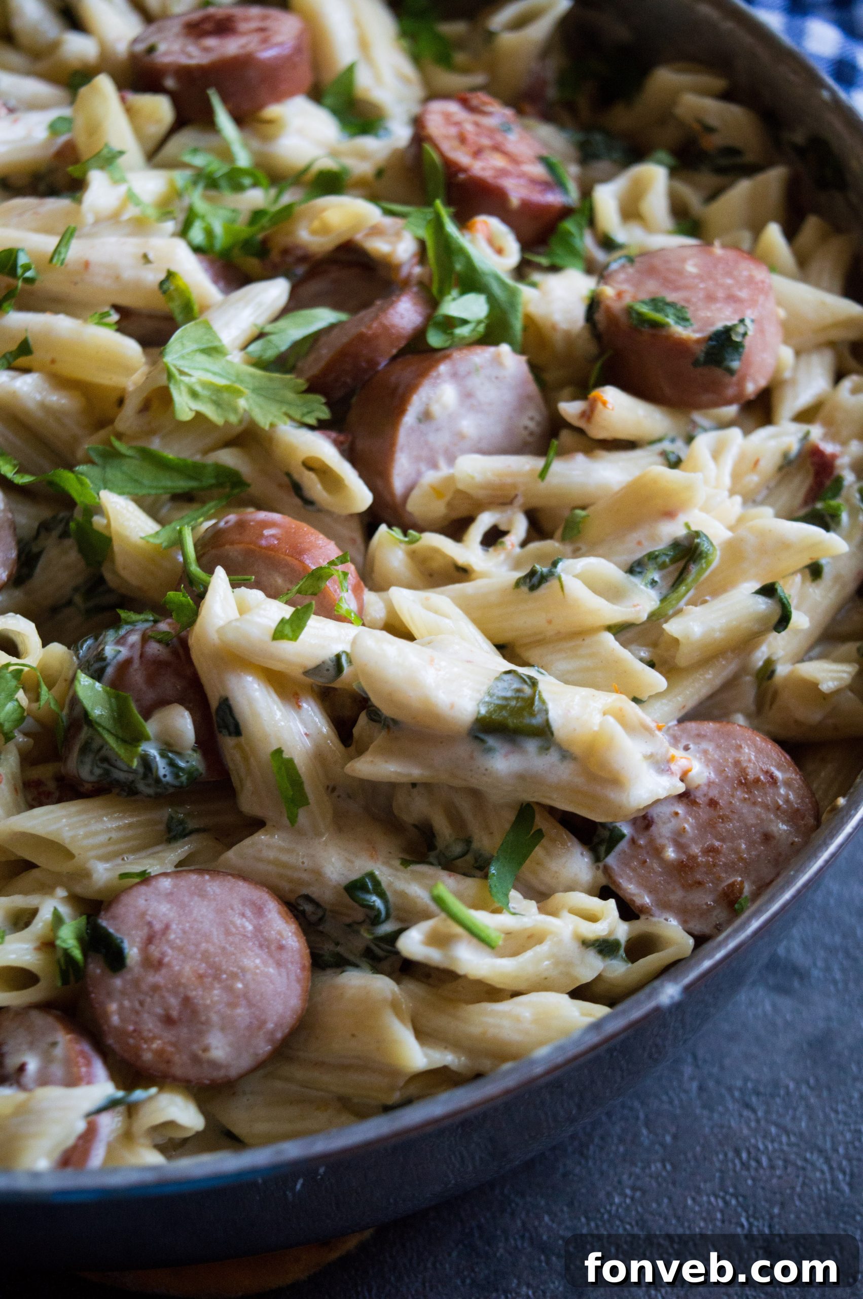 Luscious Garlic Mozzarella Pasta with Spinach and Sausage 9 The final dish, plated and ready for dinner, with rich colors and appealing textures