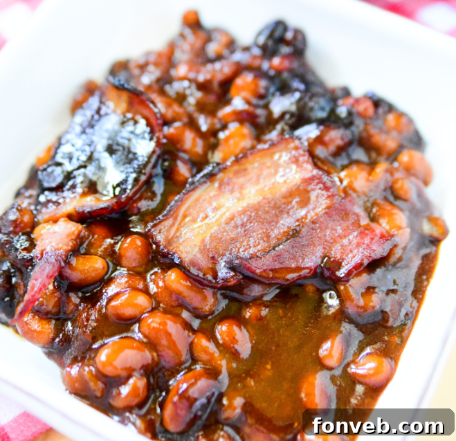 Brown Sugar Bacon Baked Beans on a white plate