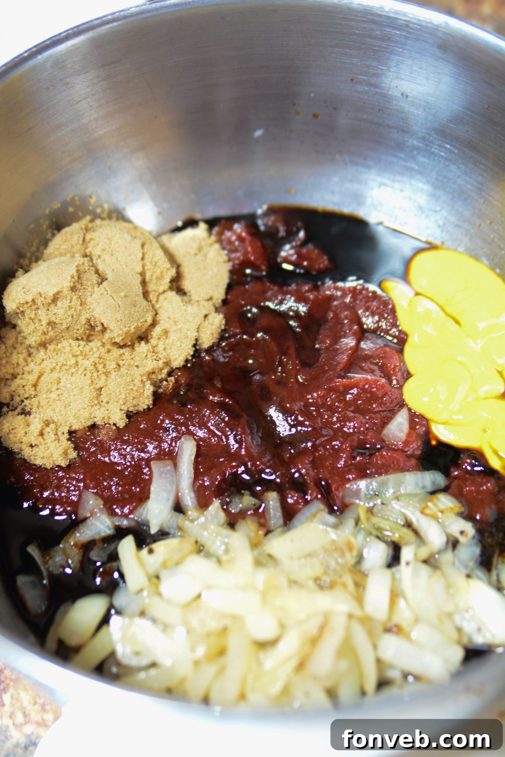 Brown Sugar Bacon Baked Beans uncooked in a bowl