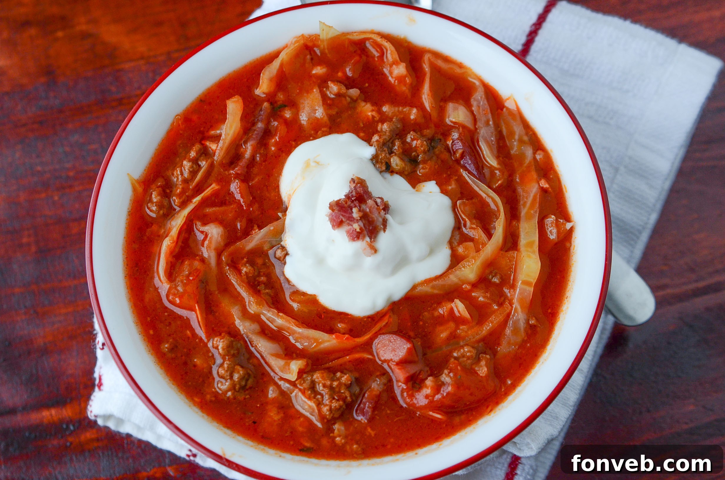 All ingredients for Crockpot Cabbage Roll Soup in a slow cooker, ready to cook
