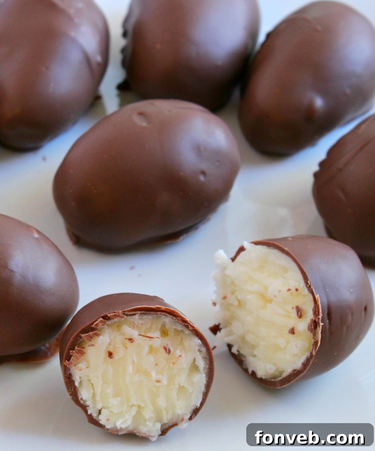 Close-up of a perfectly formed and chocolate-dipped coconut cream egg