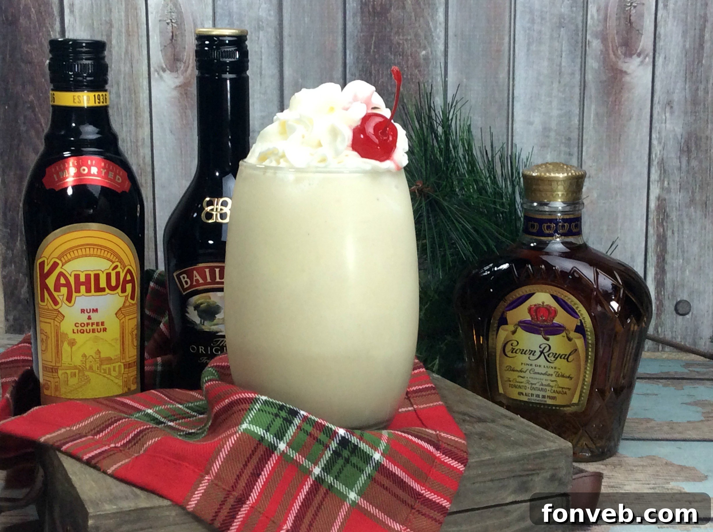 Close-up of the Alaska Duck Fart Cocktail with a focus on the creamy texture and a festive cherry on top.