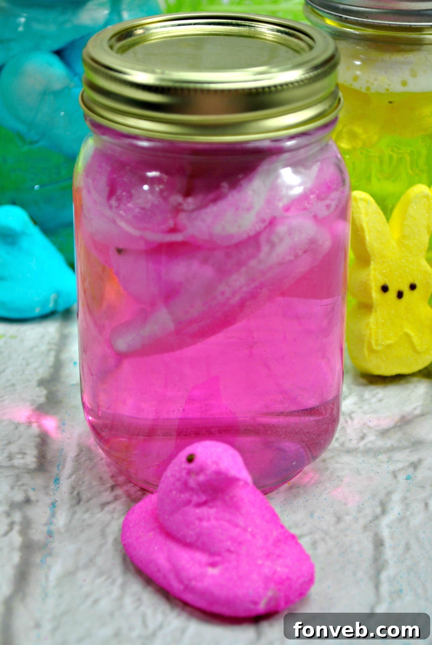 Mason jars filled with Peeps and vodka for infusion