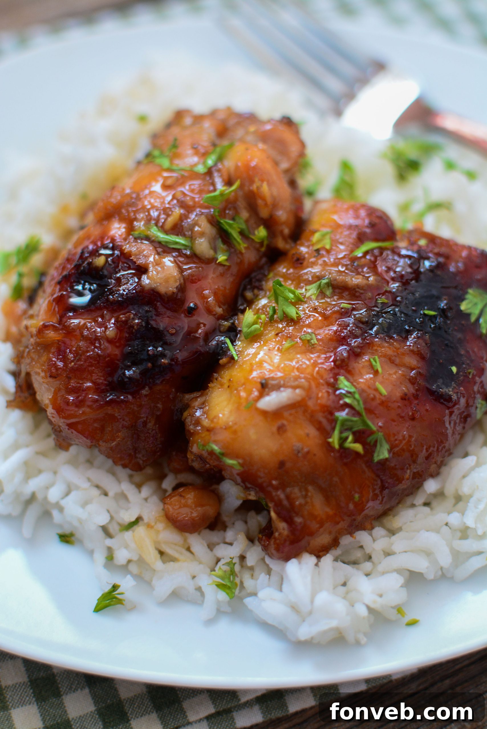 Juicy Crock Pot Garlic Brown Sugar Chicken served on a plate with garnishes