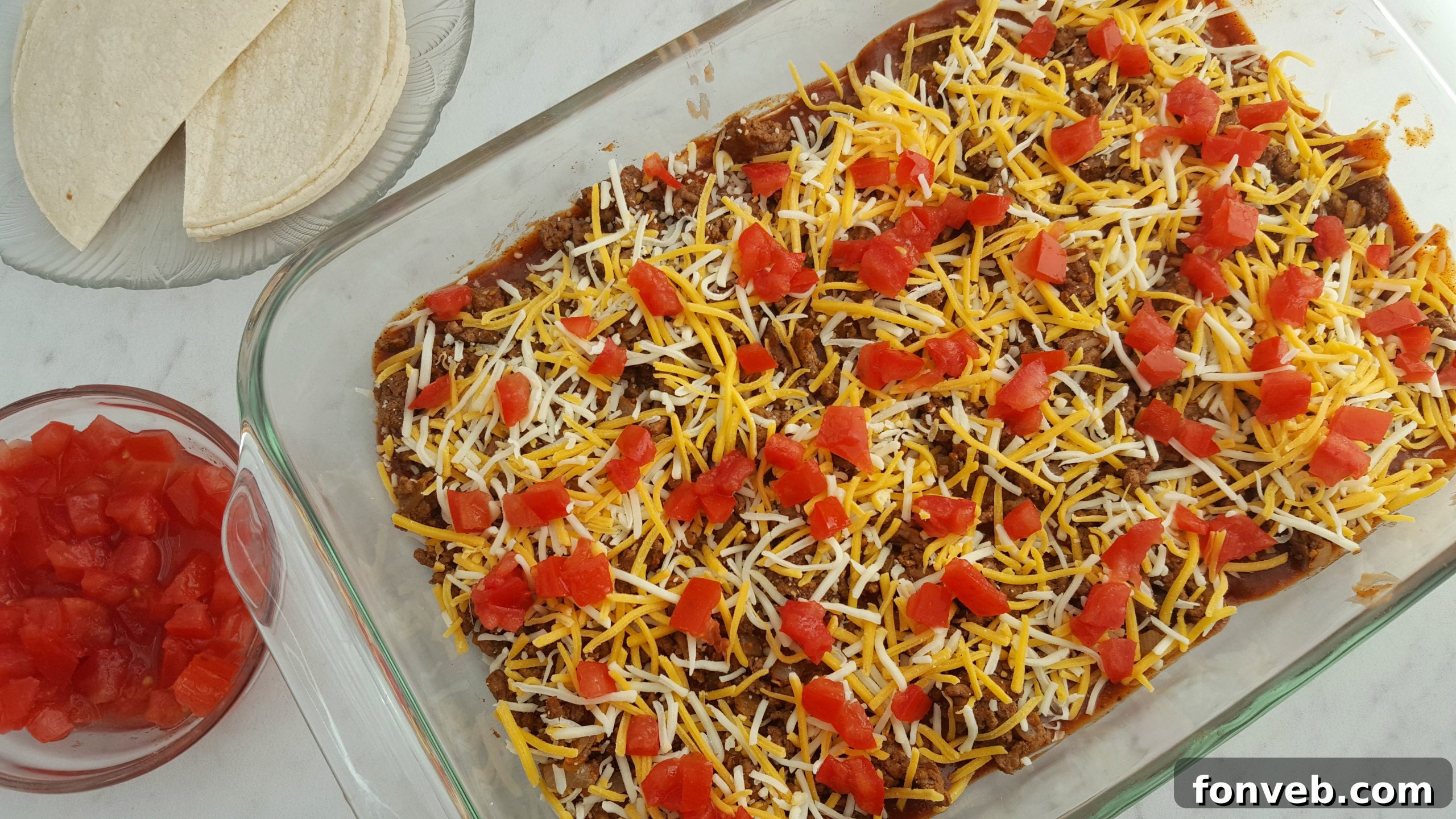Close-up of baked Mexican Lasagna with melted cheese.