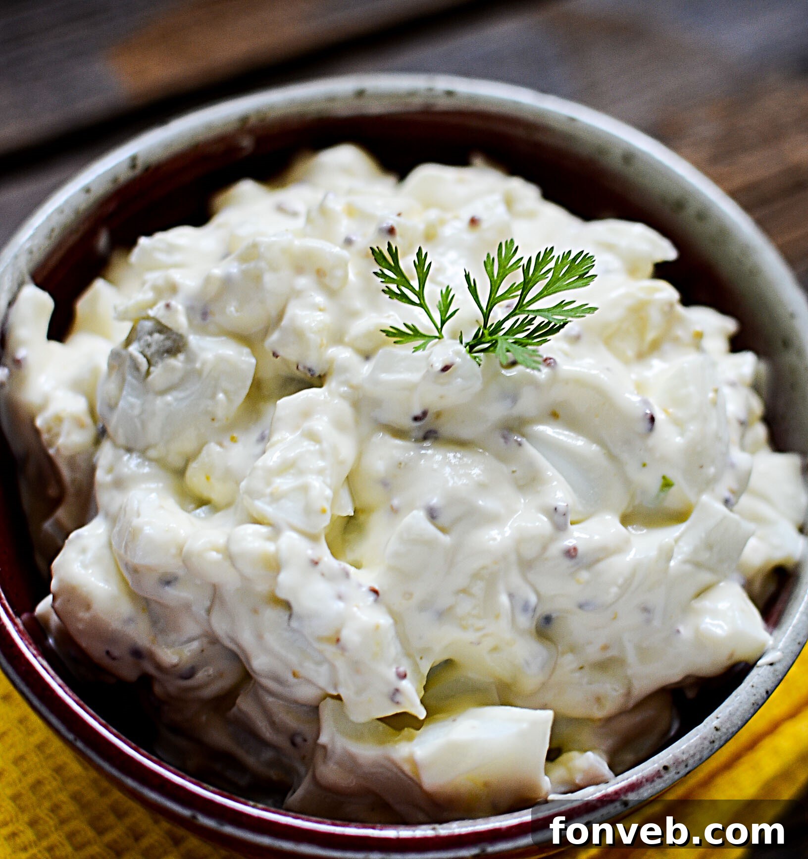Ingredients for the ultimate egg salad including hard-boiled eggs, mayonnaise, and seasonings.