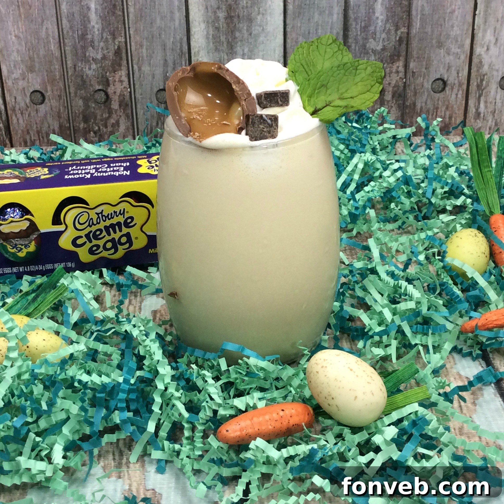 A close-up view of a single Cadbury Creme Egg, highlighting its rich chocolate and colorful fondant center.