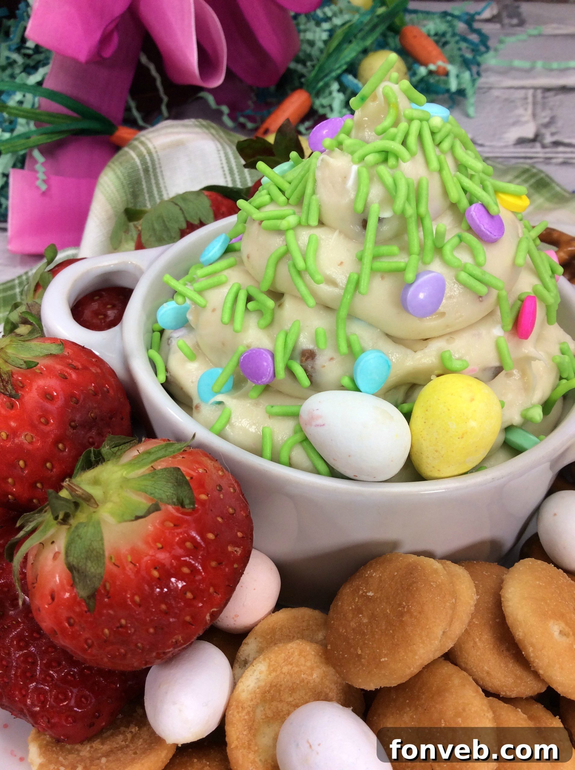 Fresh Bloom Cheesecake Dip 2 Close-up of creamy Springtime Cheesecake Dip garnished with Cadbury Mini Eggs in a white bowl