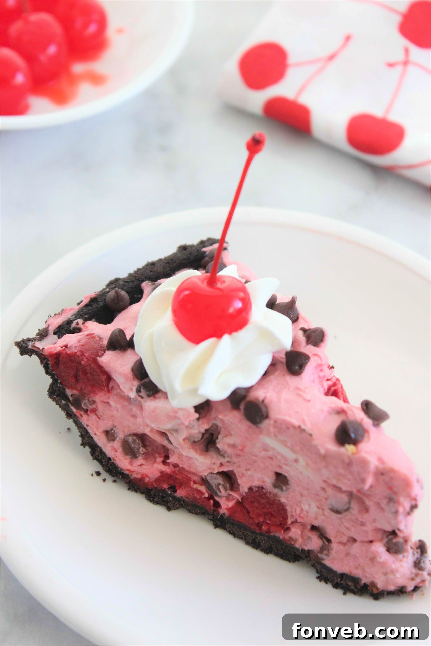 Full No-Bake Cherry Creamsicle Pie with a decorative swirl on top, ready to be chilled